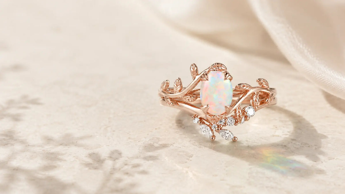 Nature-inspired opal engagement ring with rose gold leaf and vine details