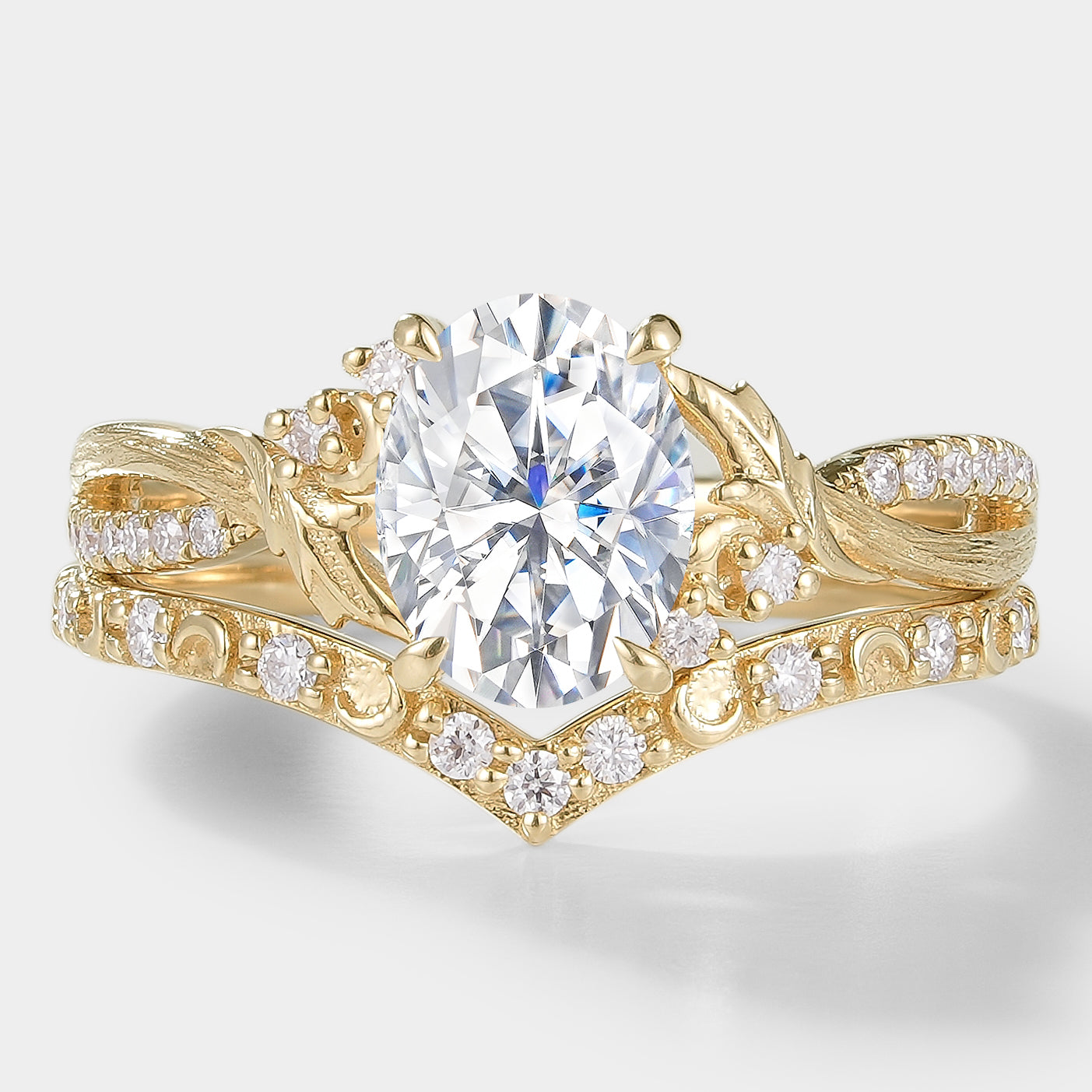 Moissanite leaf engagement ring set with bark texture and a V-shaped wedding band, 14k gold