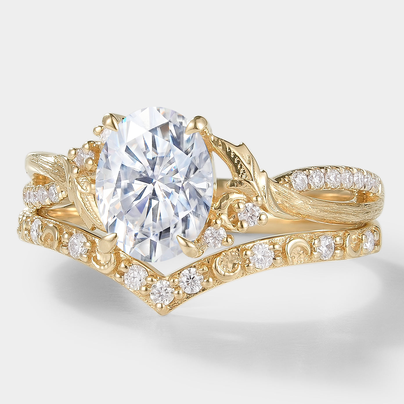 Moissanite leaf engagement ring set, 14k gold. Vintage bridal set with bark texture and V-shaped wedding band.