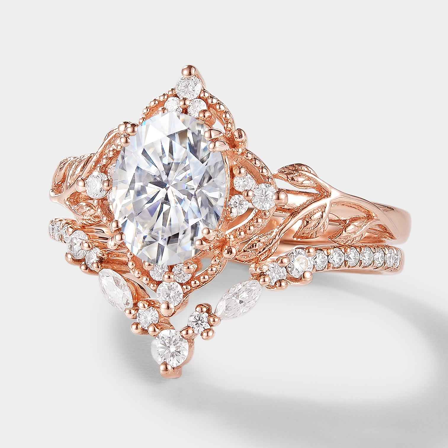 Nature-inspired oval moissanite engagement ring set