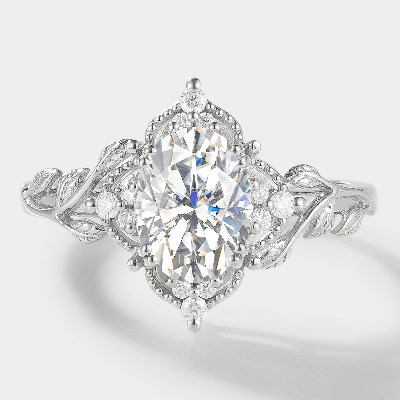 Oval moissanite leaf engagement ring in white gold – Sylva