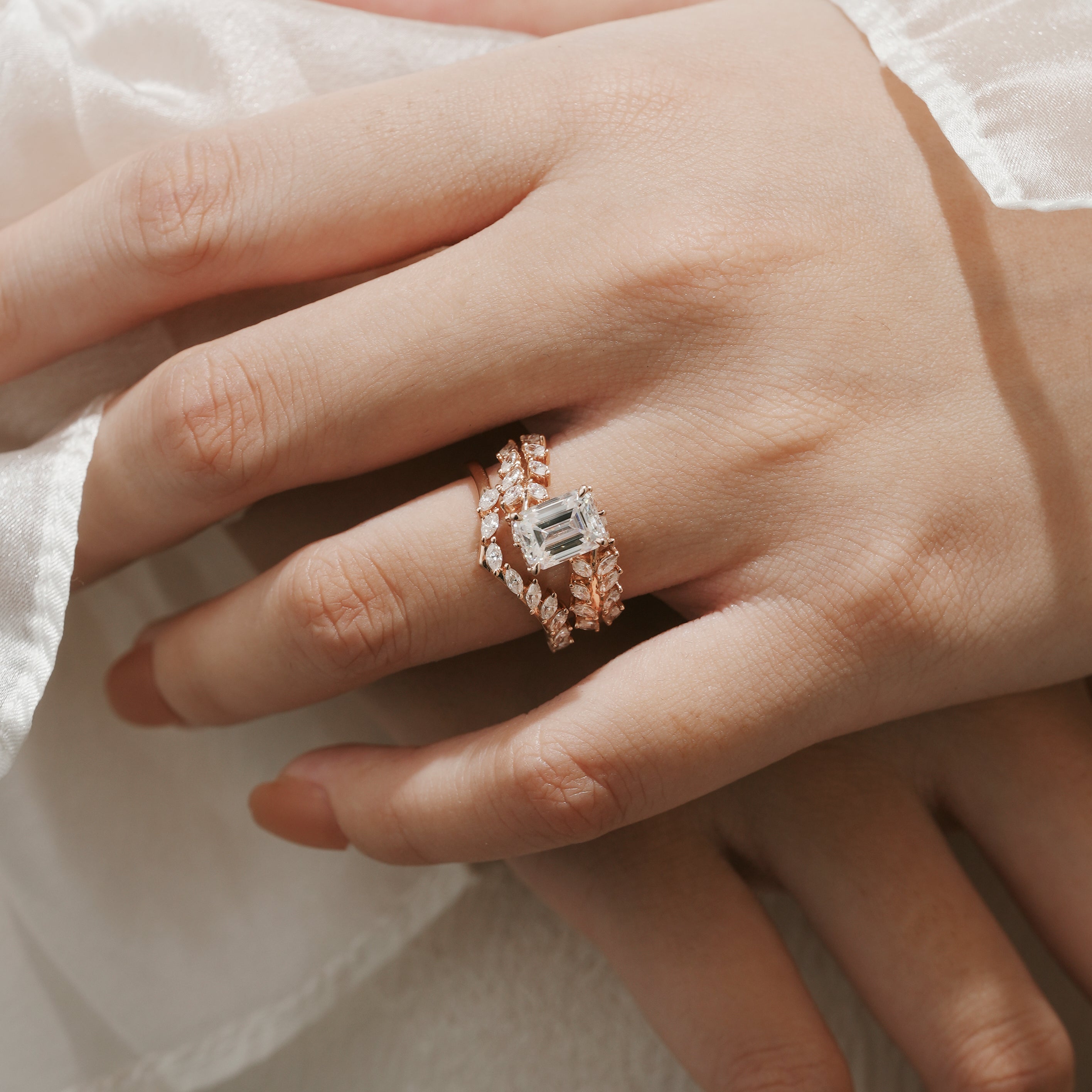Emerald cut moissanite leaf ring set on hand, rose gold, Lahela Jewelry