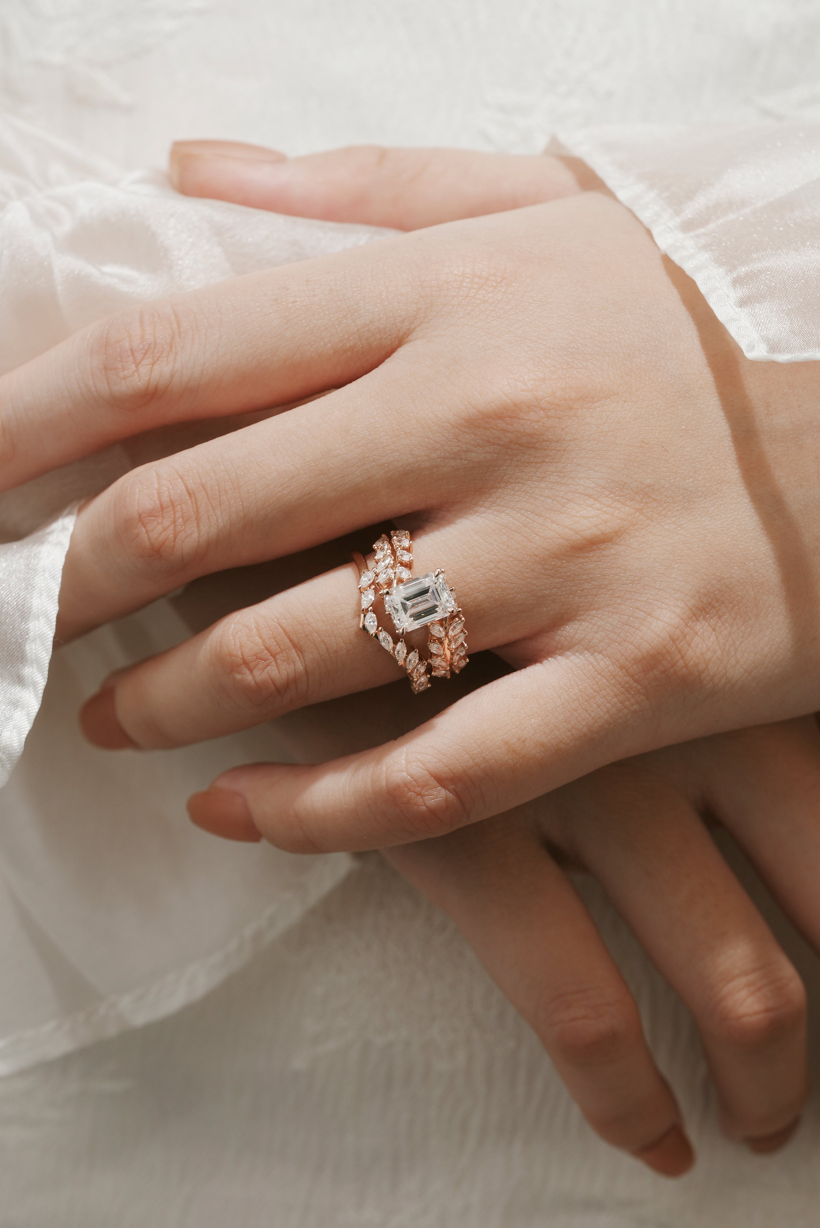 Emerald cut moissanite leaf ring set on hand, rose gold, Lahela Jewelry