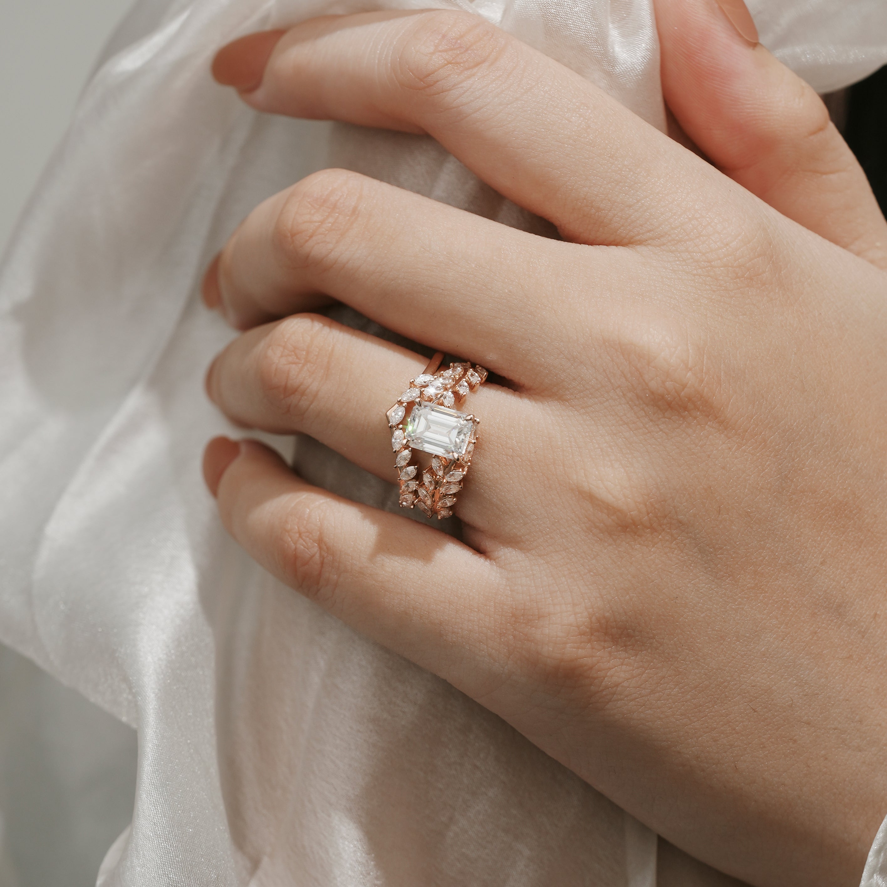 Rose gold leaf moissanite ring set on hand, bridal jewelry