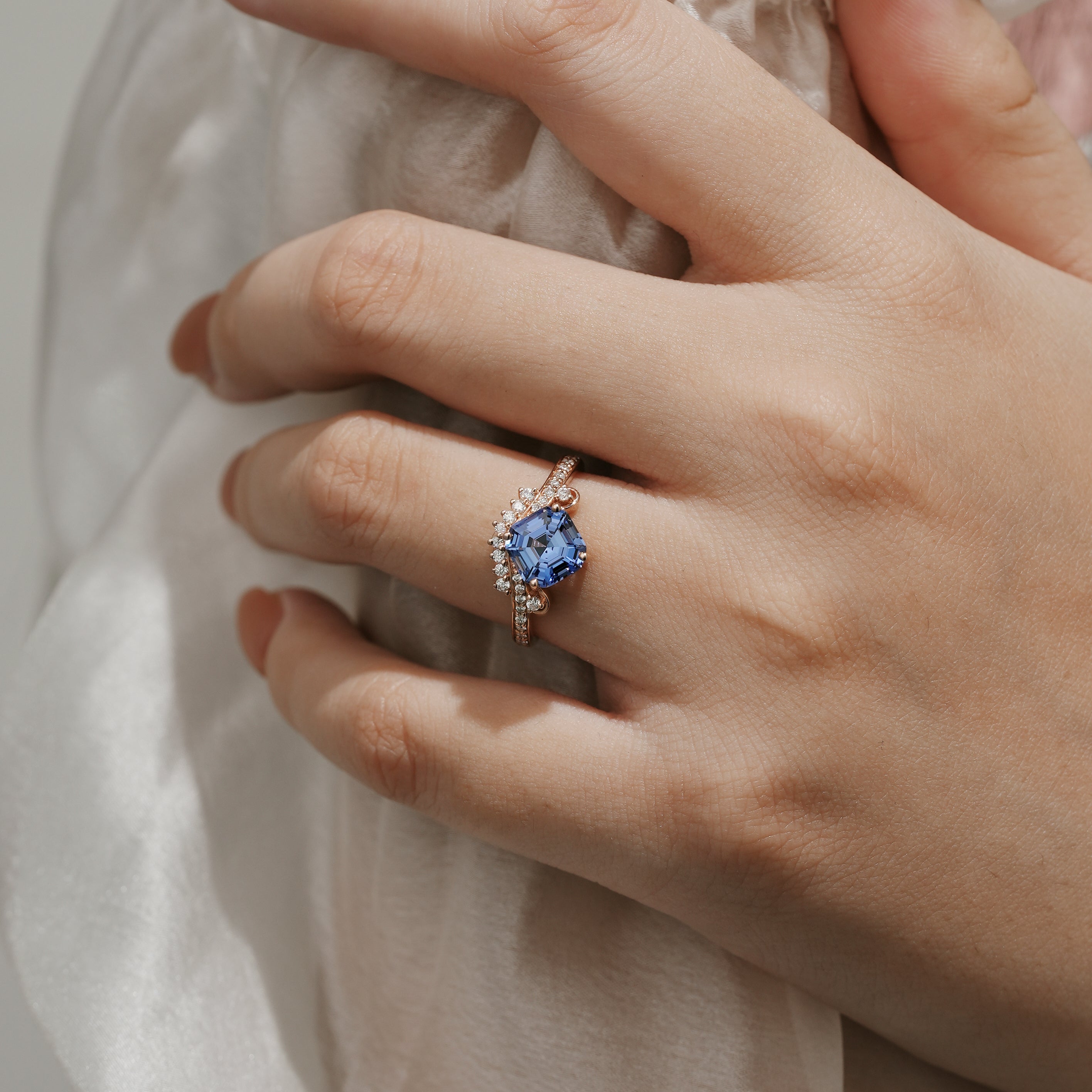 Woman's hand with Cushion Cut Lab Cornflower Sapphire Engagement Ring