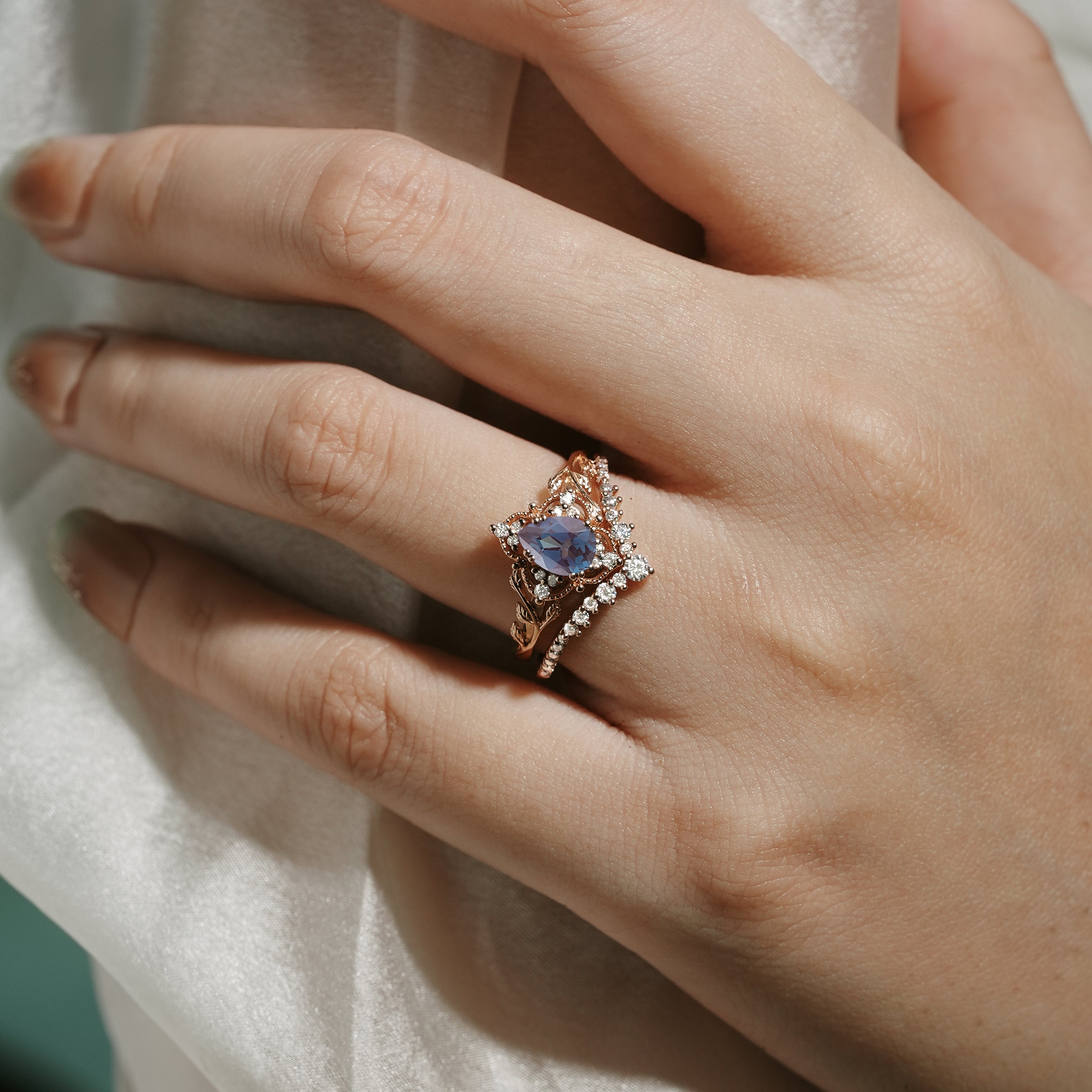 Rose gold pear-cut alexandrite bridal set with moissanite accents, vintage engagement ring set