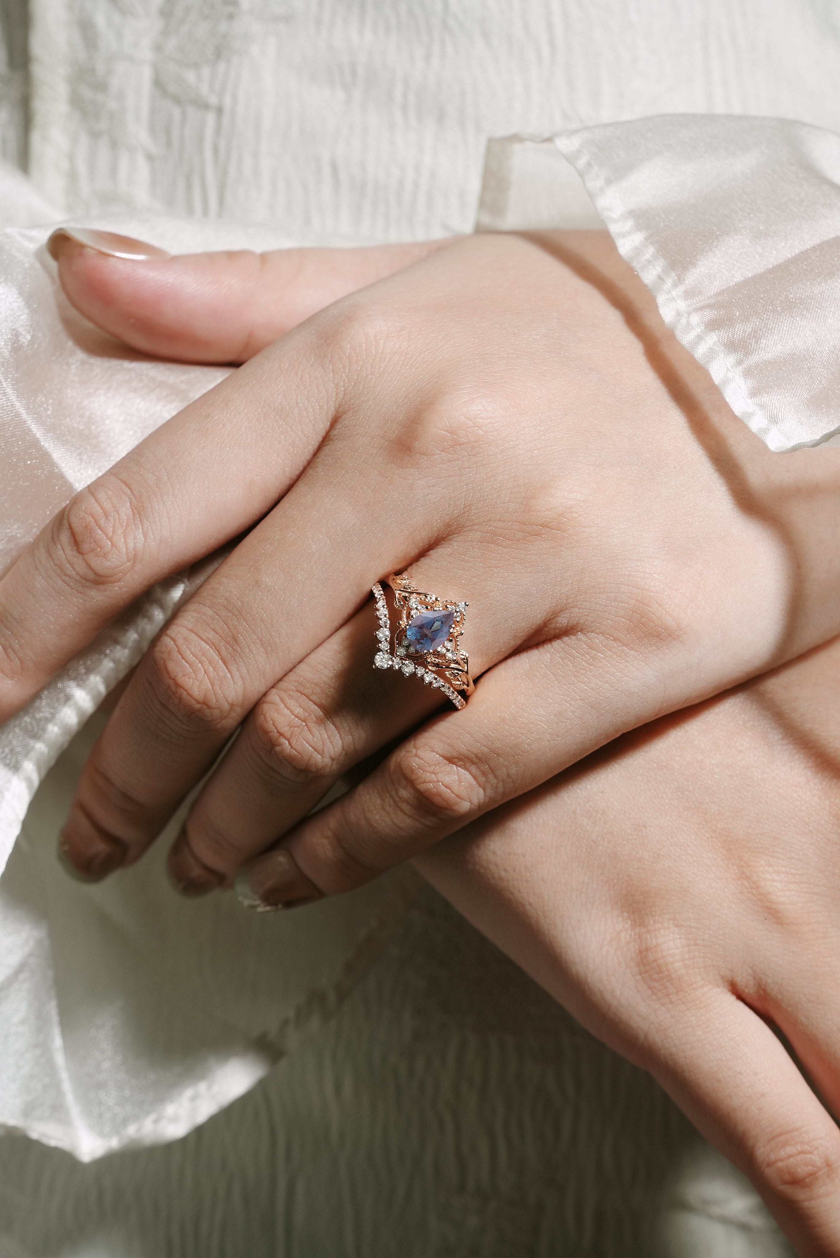 Rose gold pear-cut alexandrite bridal set with leaf details, moissanite accents, vintage style ring set