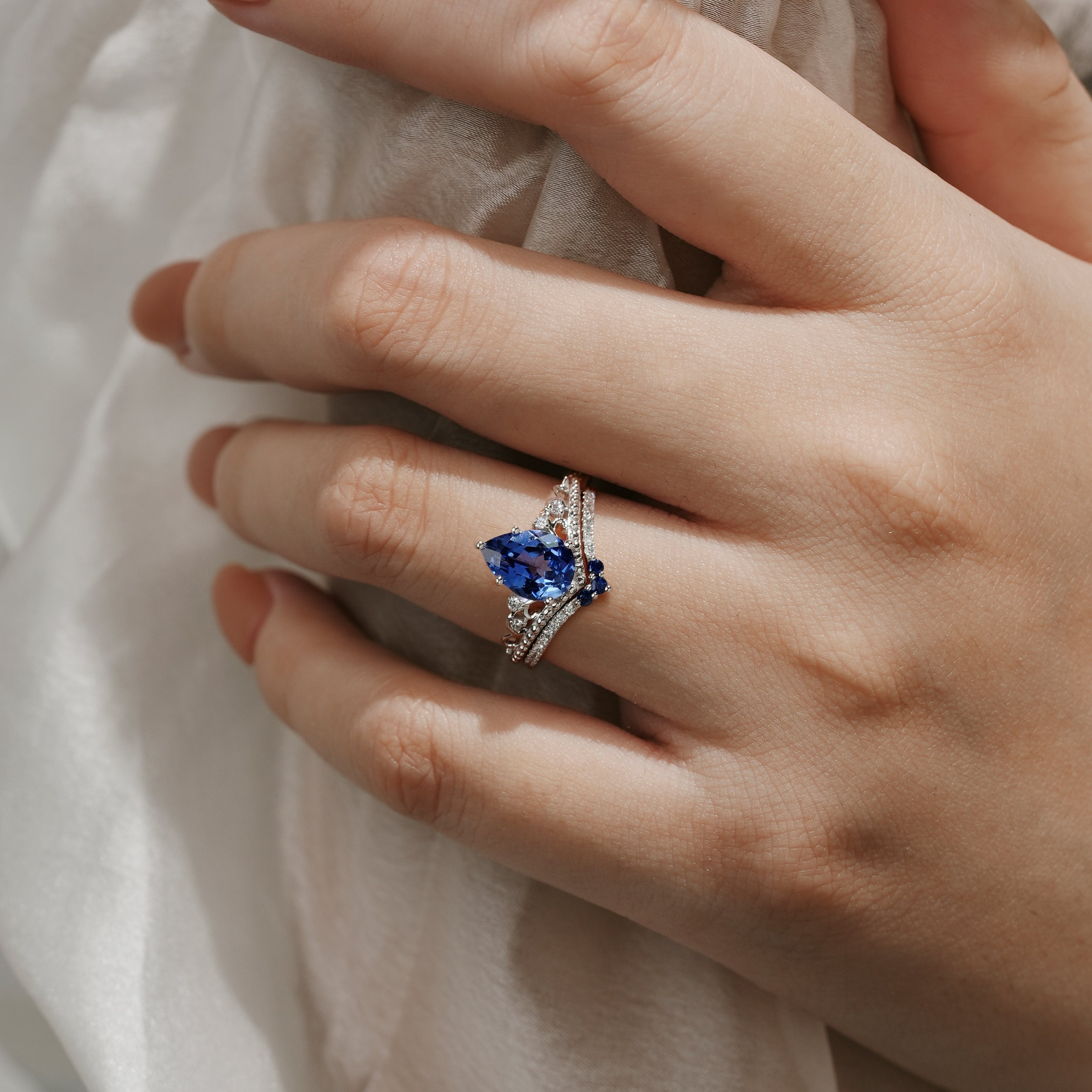 Hand wearing Vintage Cornflower Sapphire Engagement Ring Set