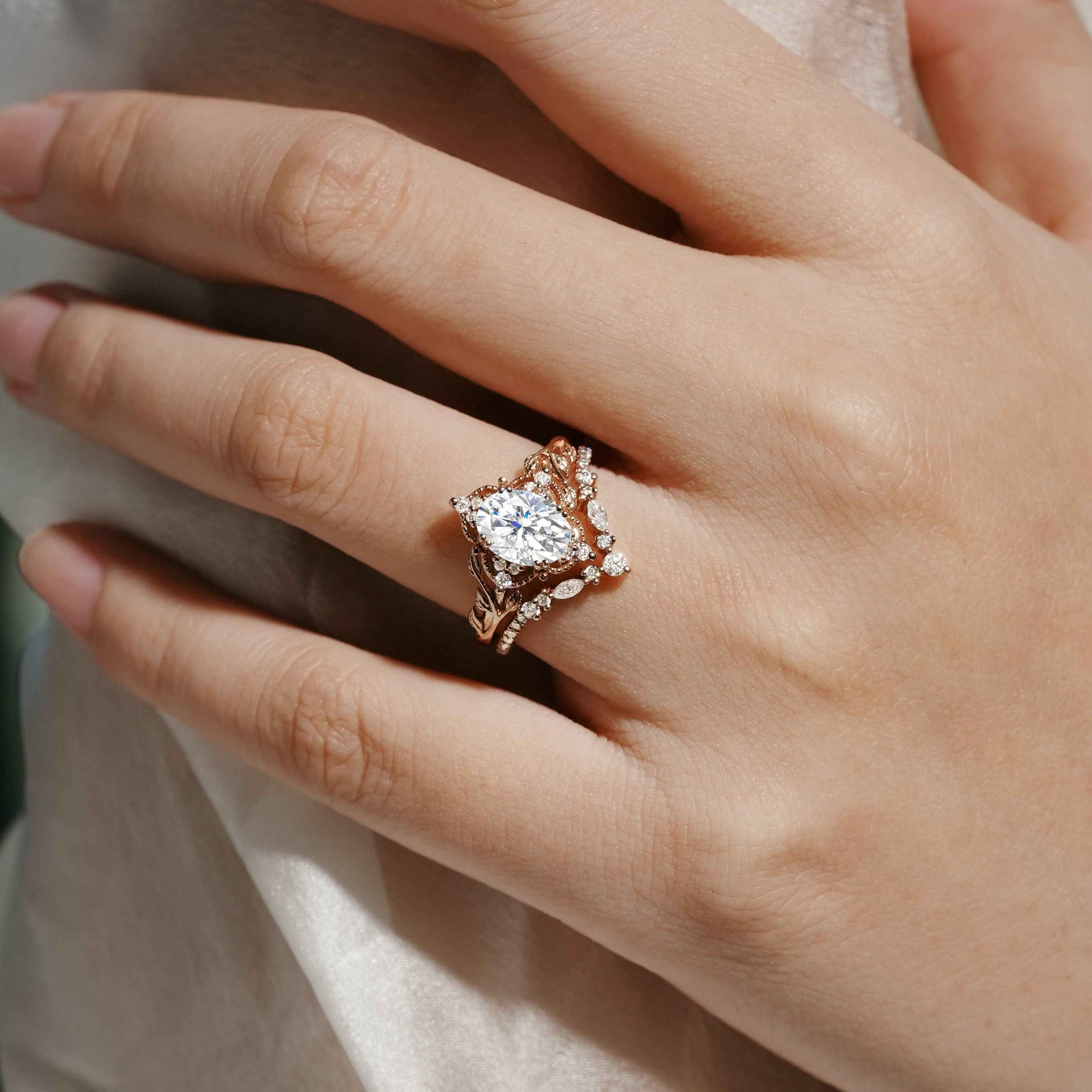 Moissanite leaf engagement ring bridal set on a hand