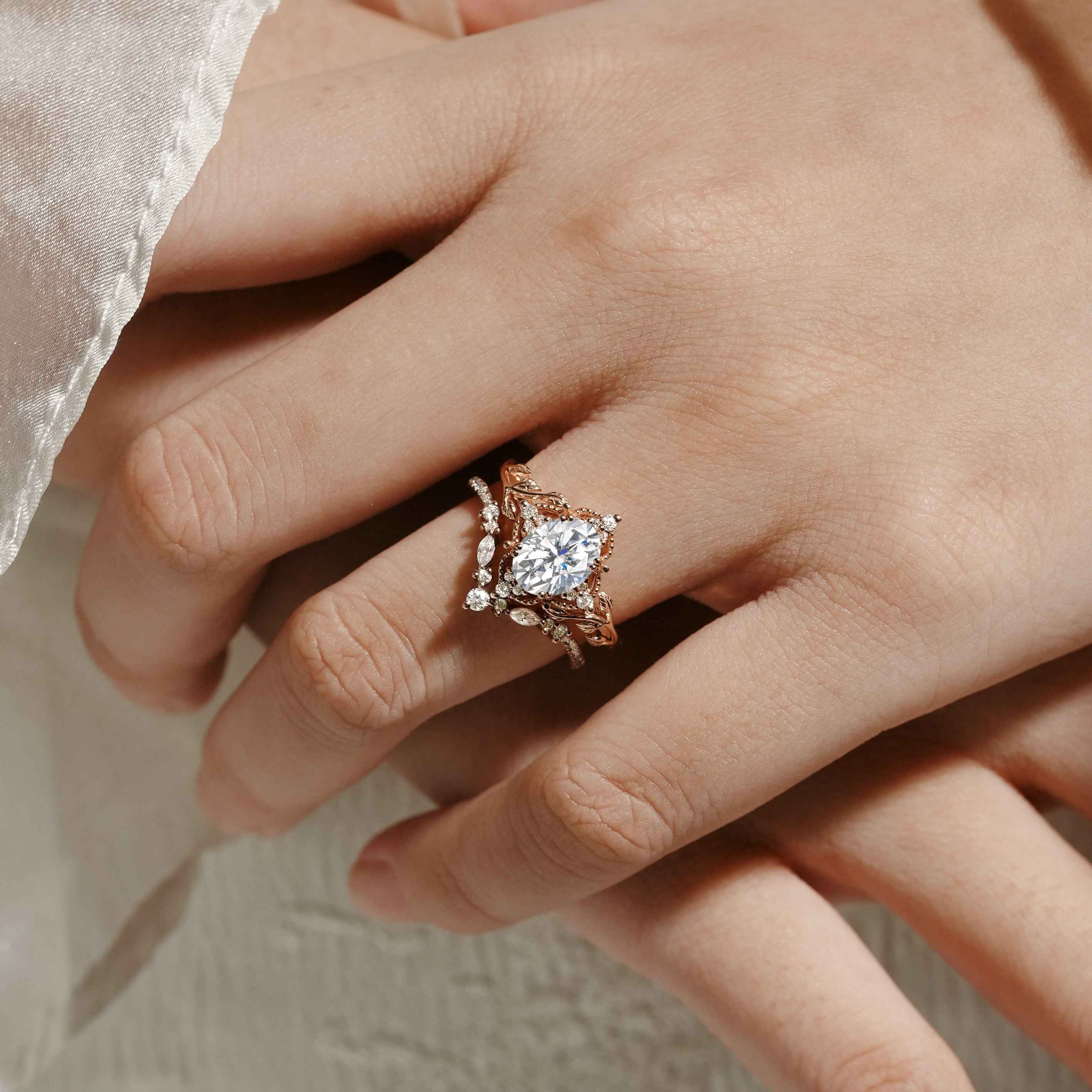 Rose gold moissanite leaf bridal set on a hand