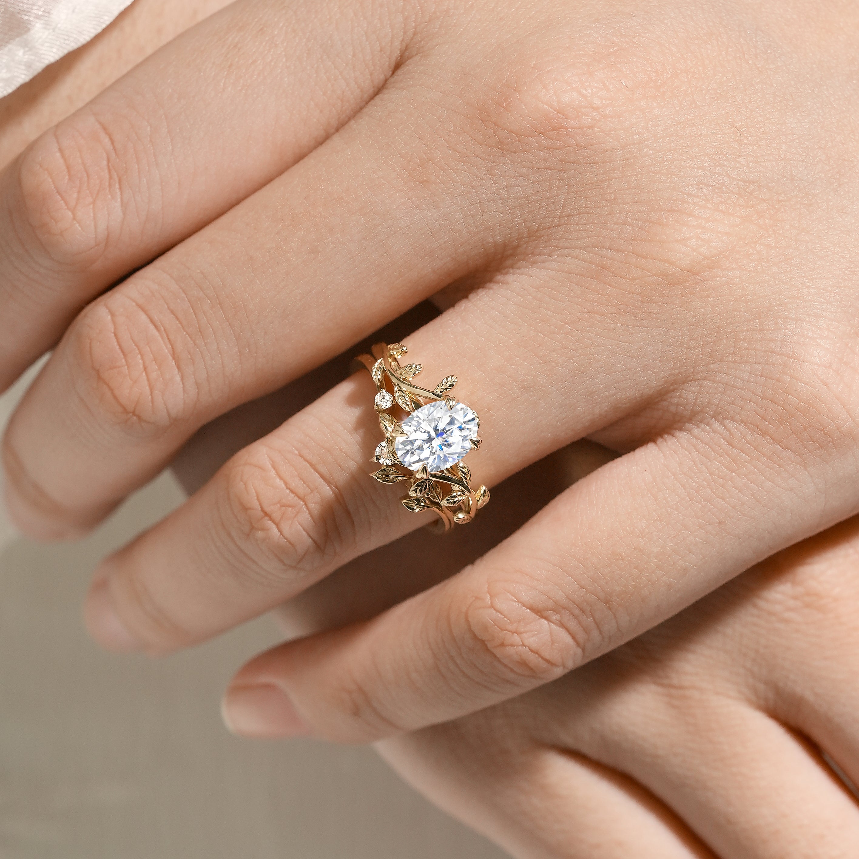 Nature-inspired oval moissanite engagement ring in gold