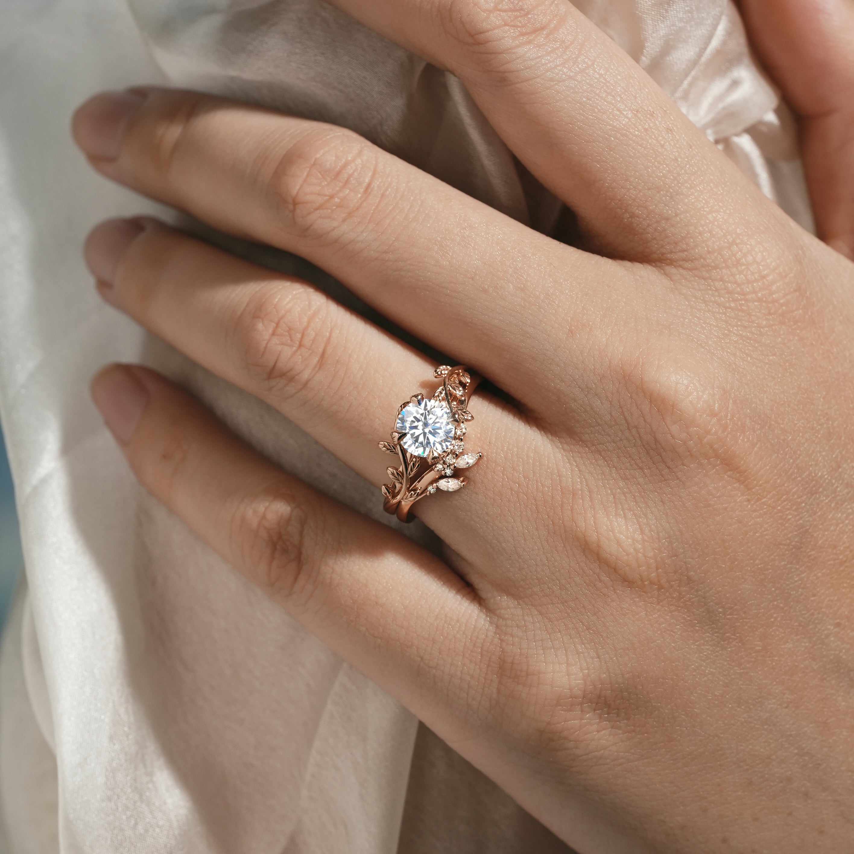 Rose gold leaf engagement ring with round moissanite