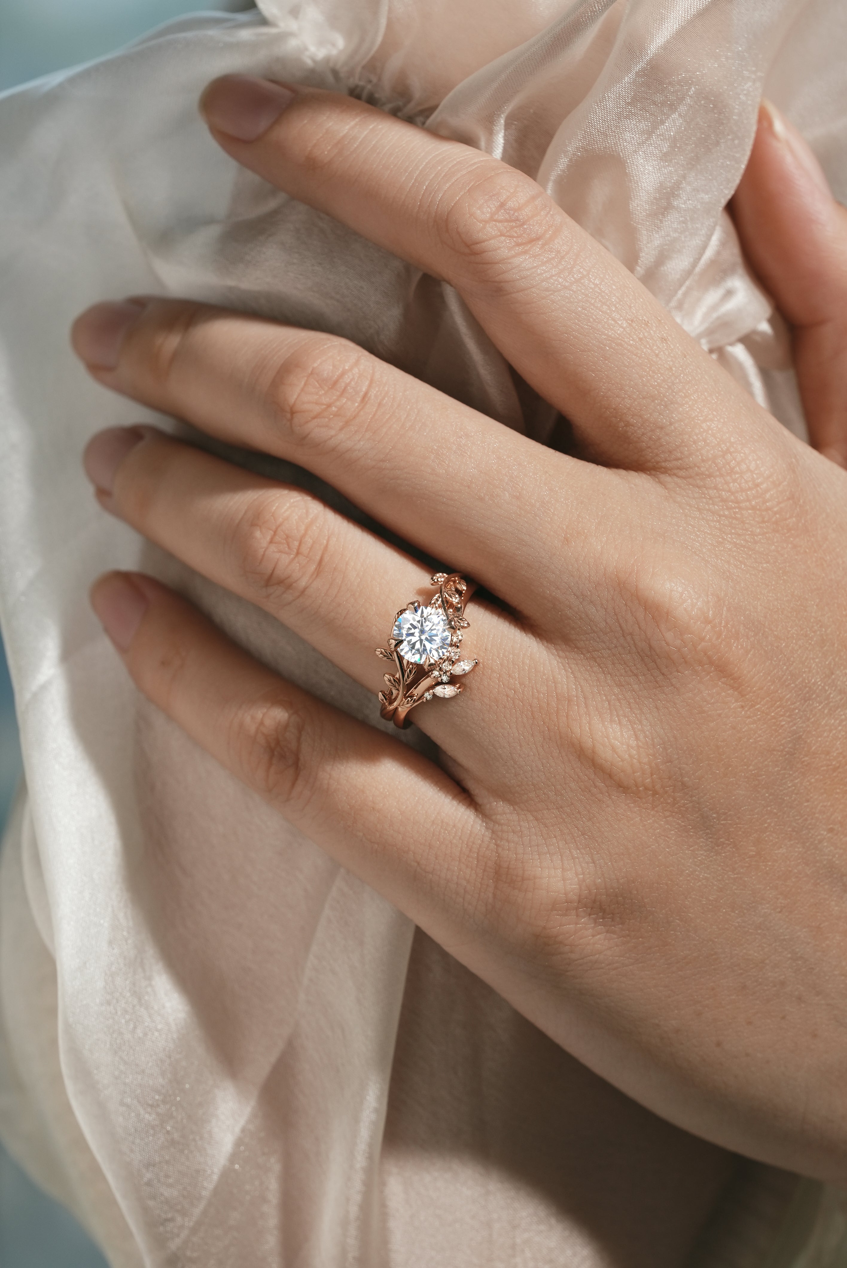 Rose gold leaf engagement ring with round moissanite
