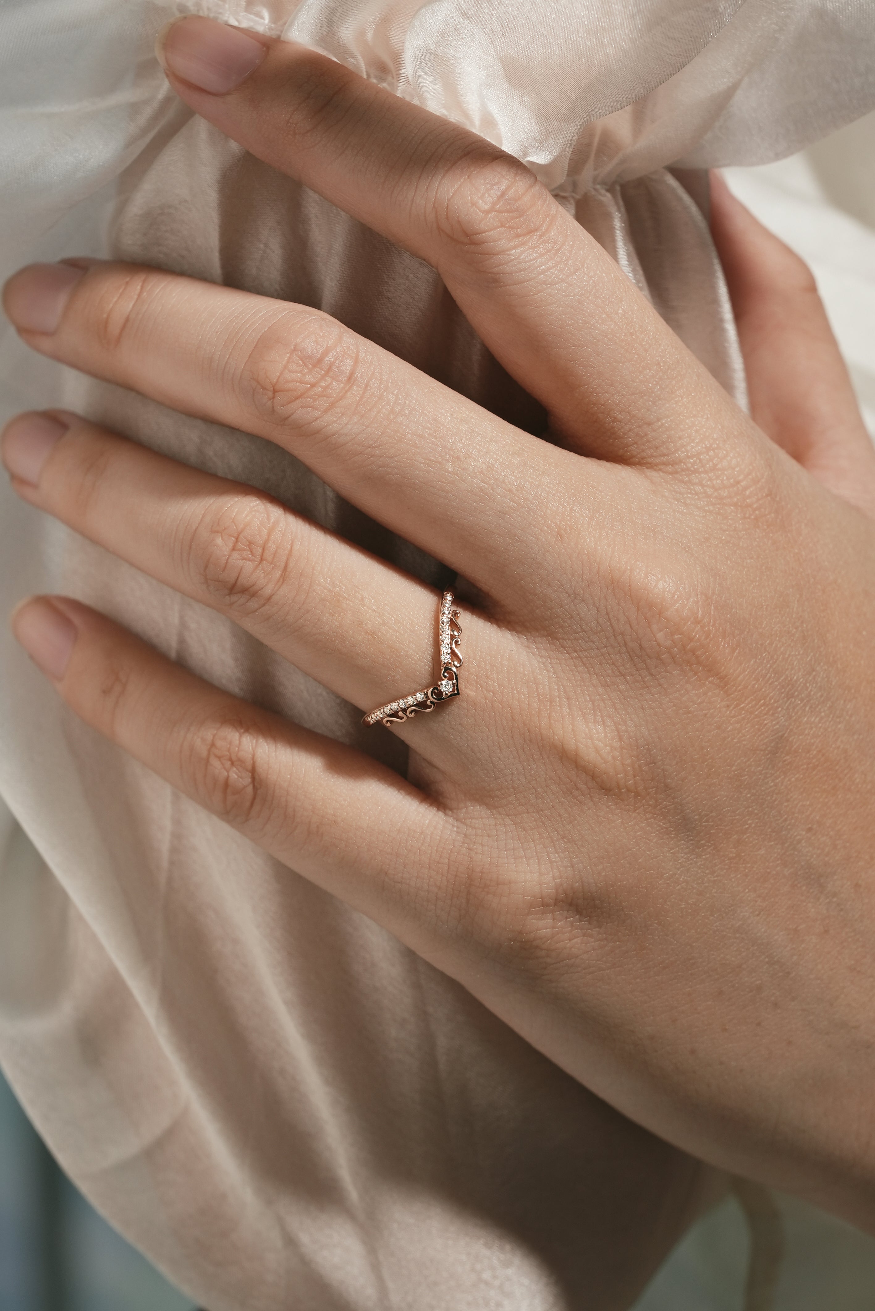 Chevron moissanite wedding band on finger, Lahela Jewelry