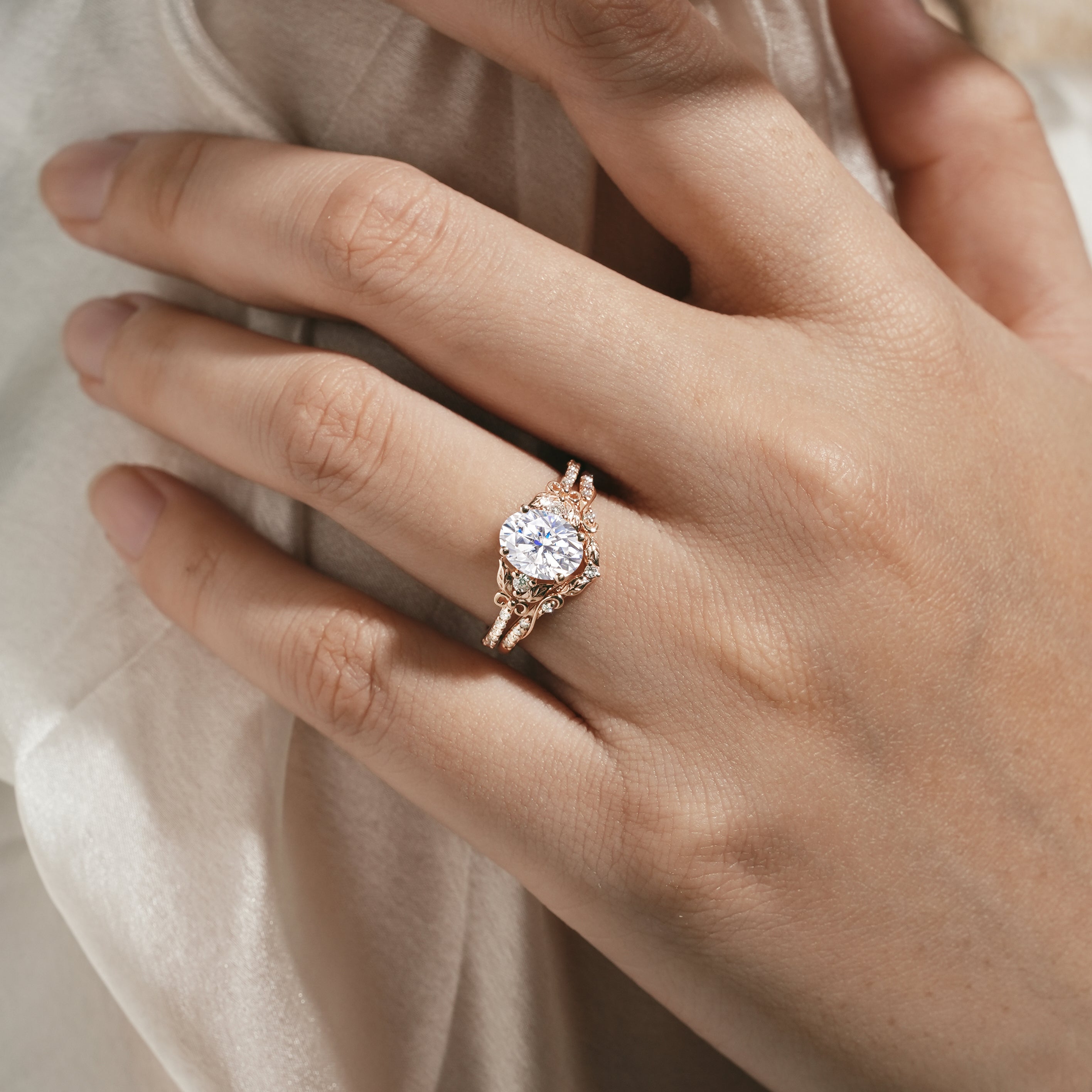 Rose gold leaf-inspired moissanite ring set on hand