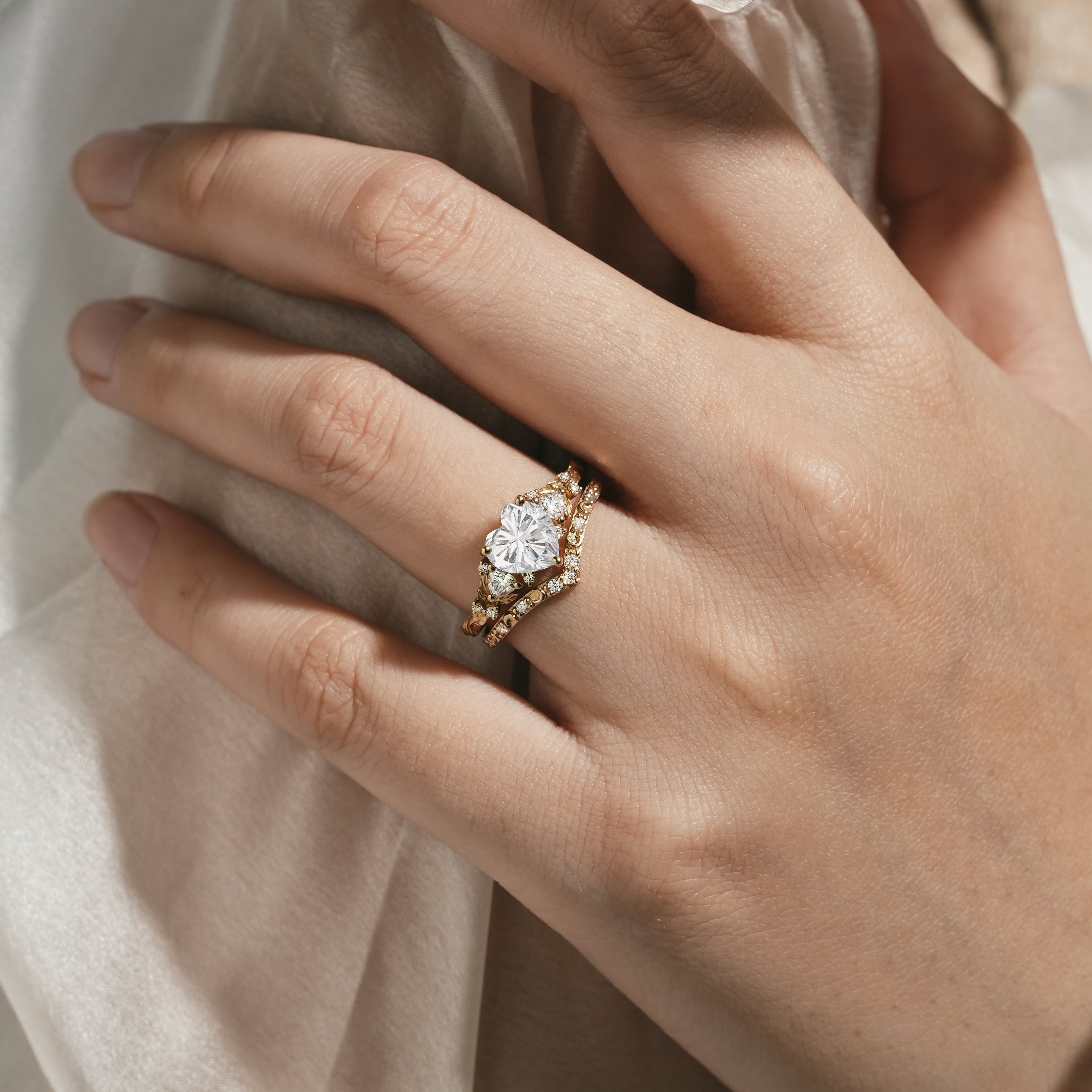 Heart-cut moissanite engagement ring and moon wedding band