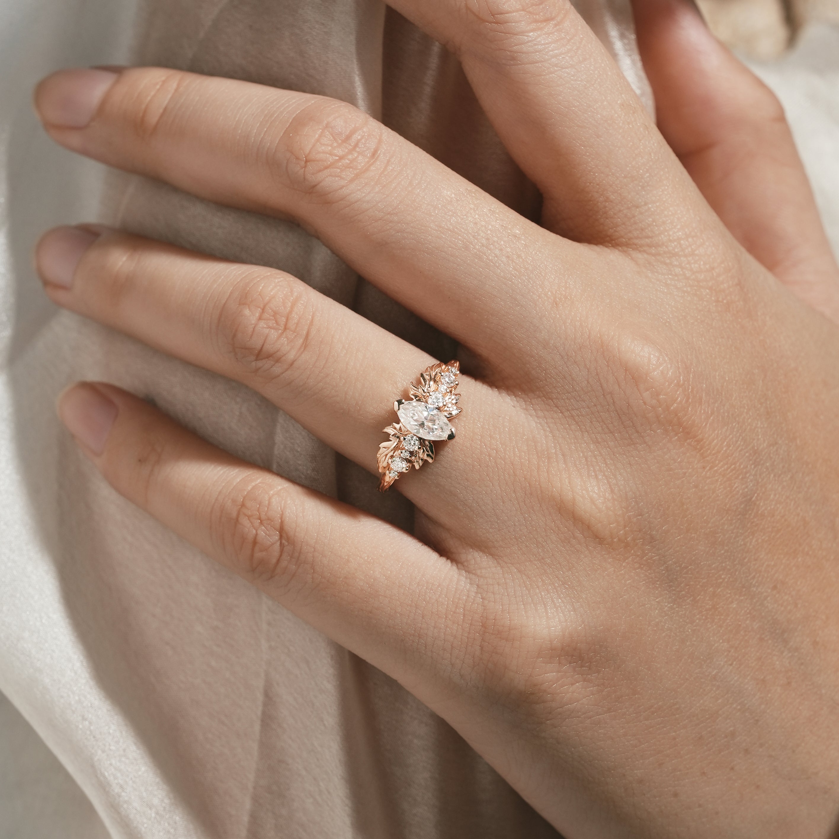 Elegant marquise moissanite engagement ring on a hand