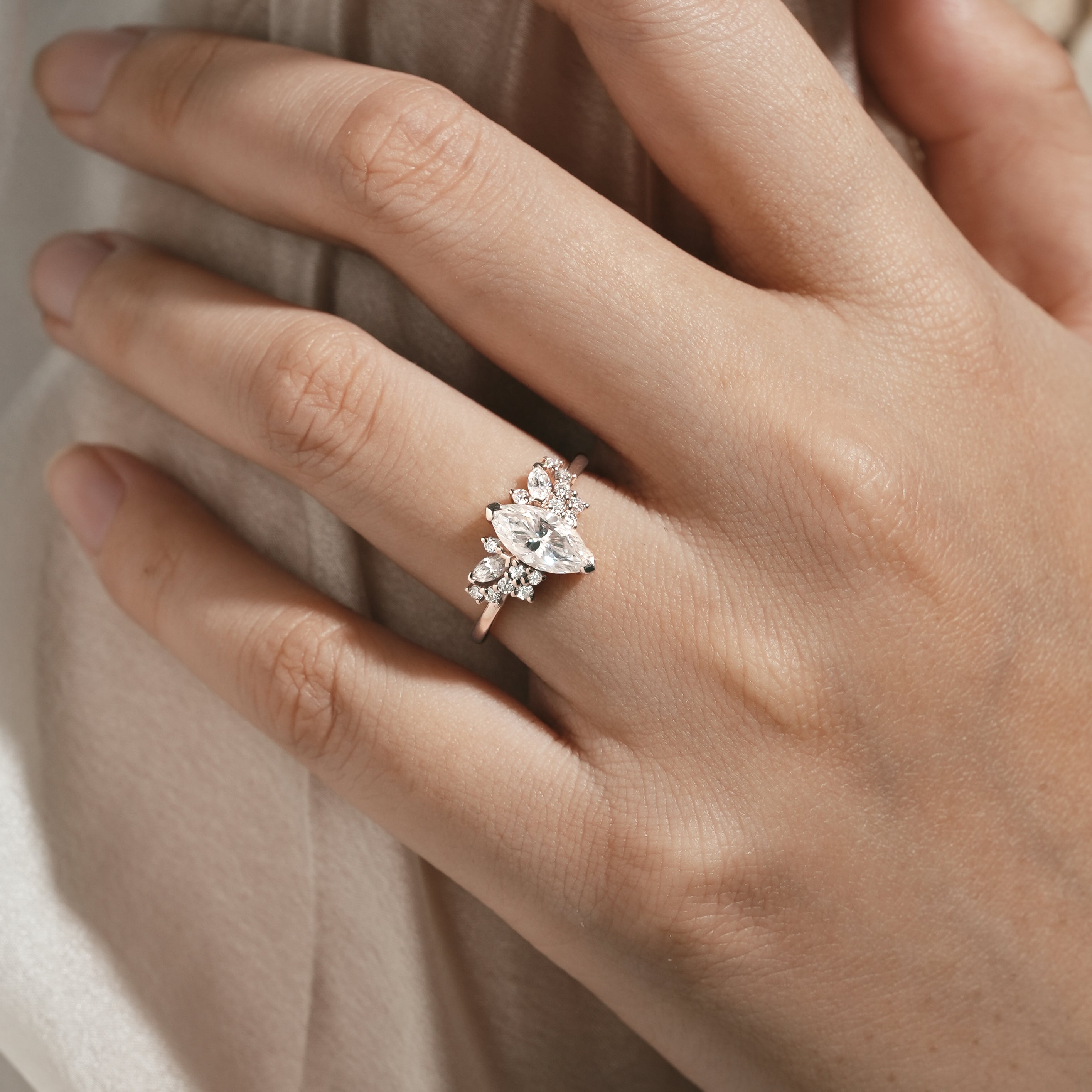 Marquise Cut Moissanite Engagement Ring on hand