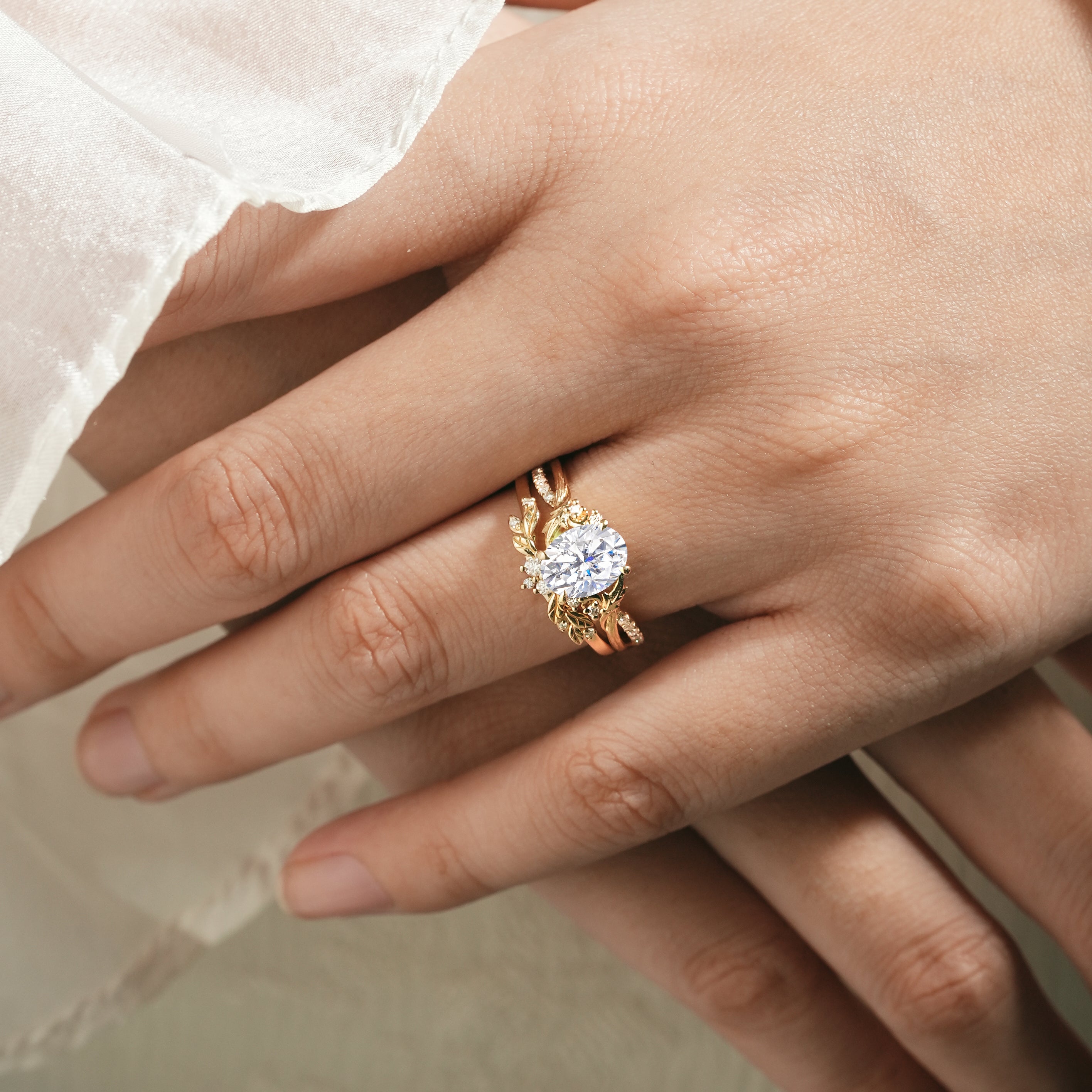 Moissanite leaf engagement ring on a woman's hand, Lahela Jewelry