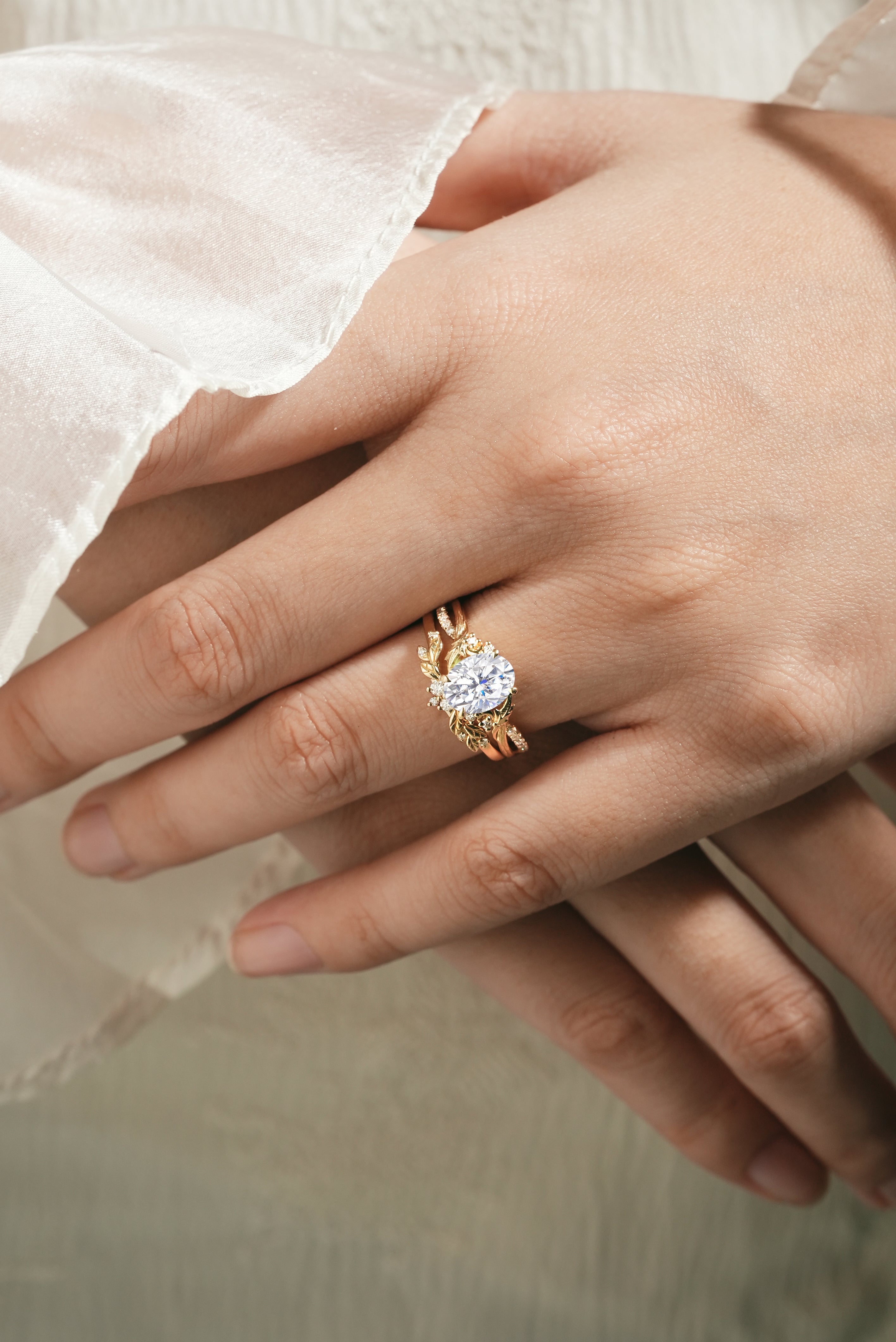 Moissanite leaf engagement ring on a woman's hand, Lahela Jewelry