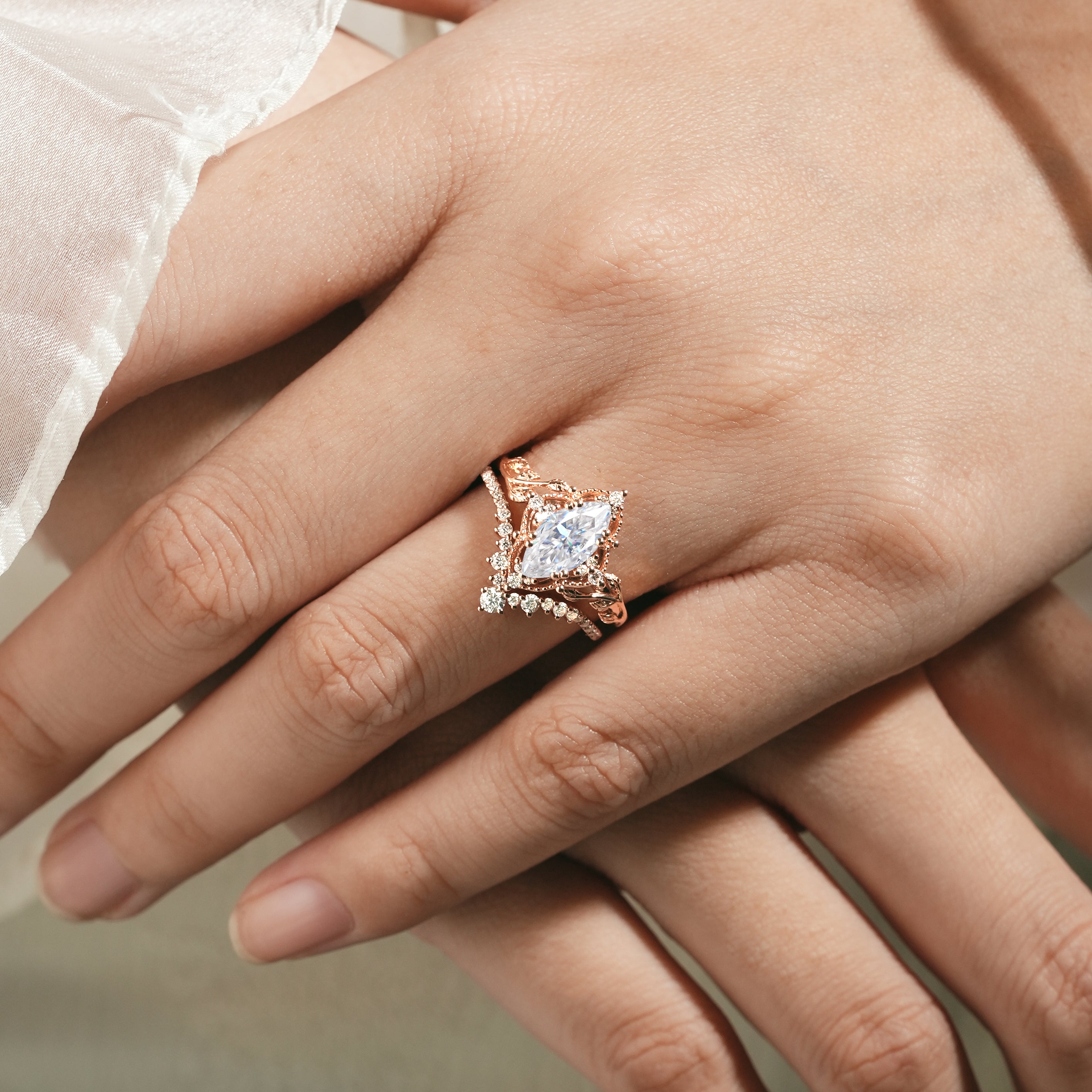 Marquise moissanite engagement ring and curved band, rose gold