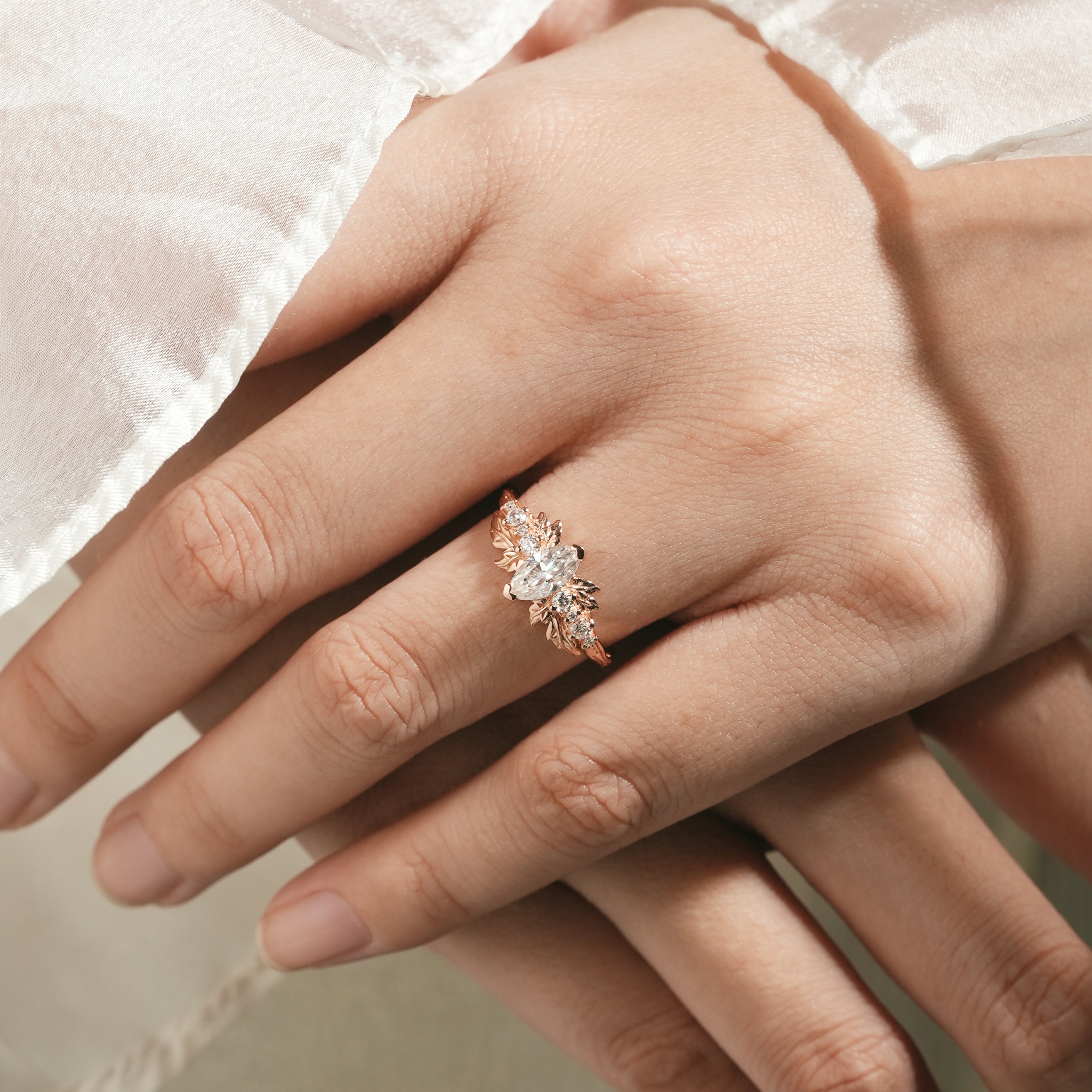 Marquise moissanite leaf engagement ring on hand