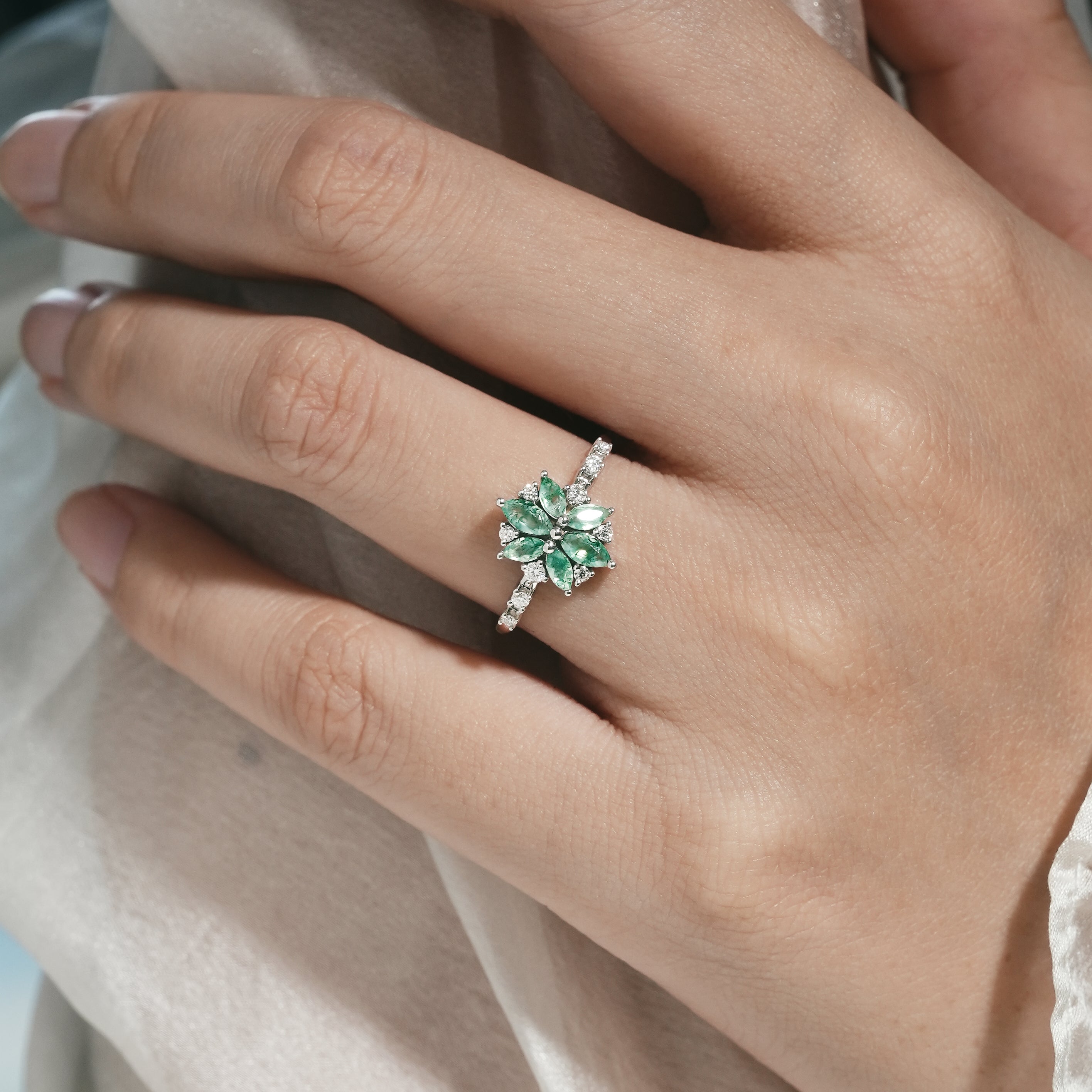 Moss Agate Engagement Ring on a hand