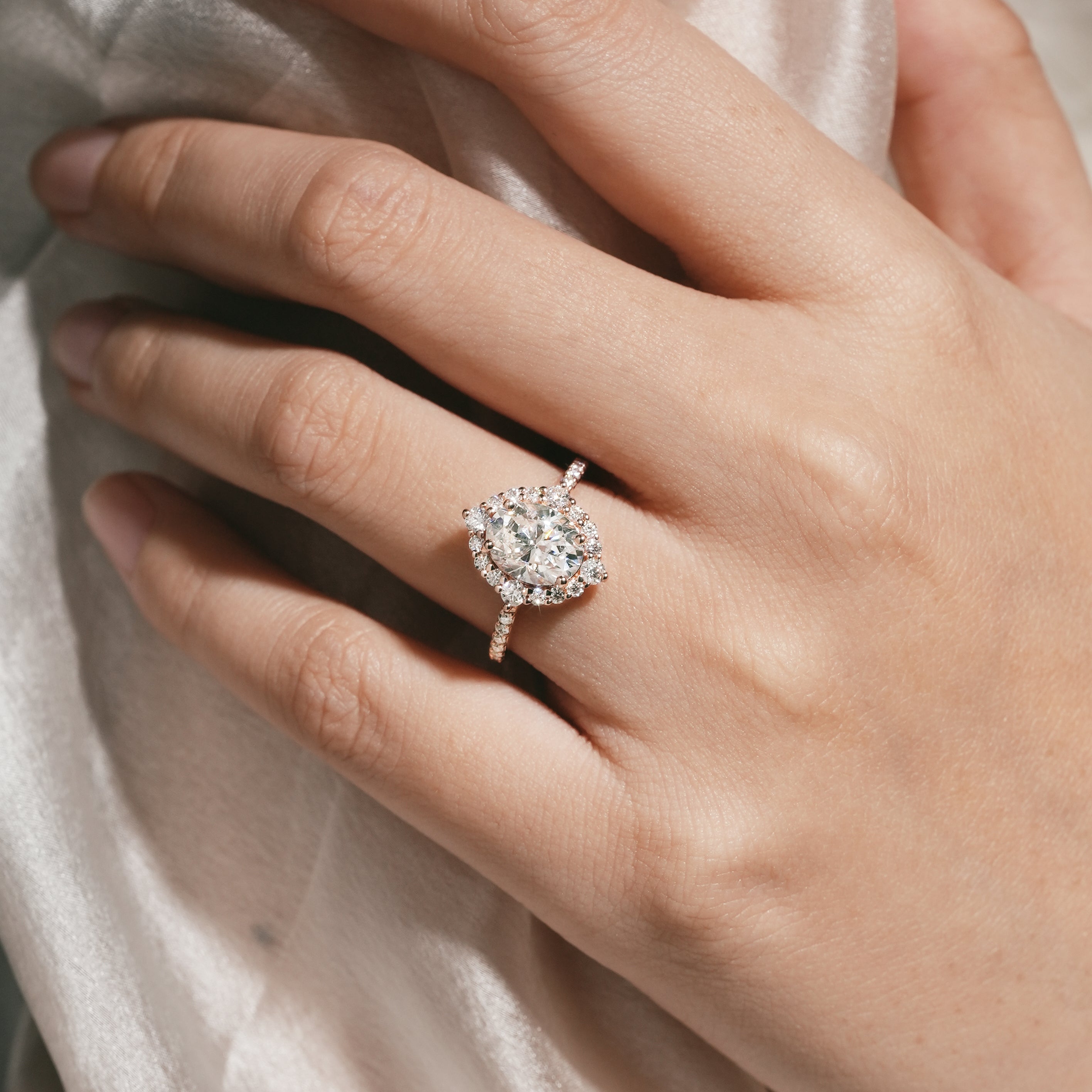 Oval Moissanite Halo Engagement Ring on a hand
