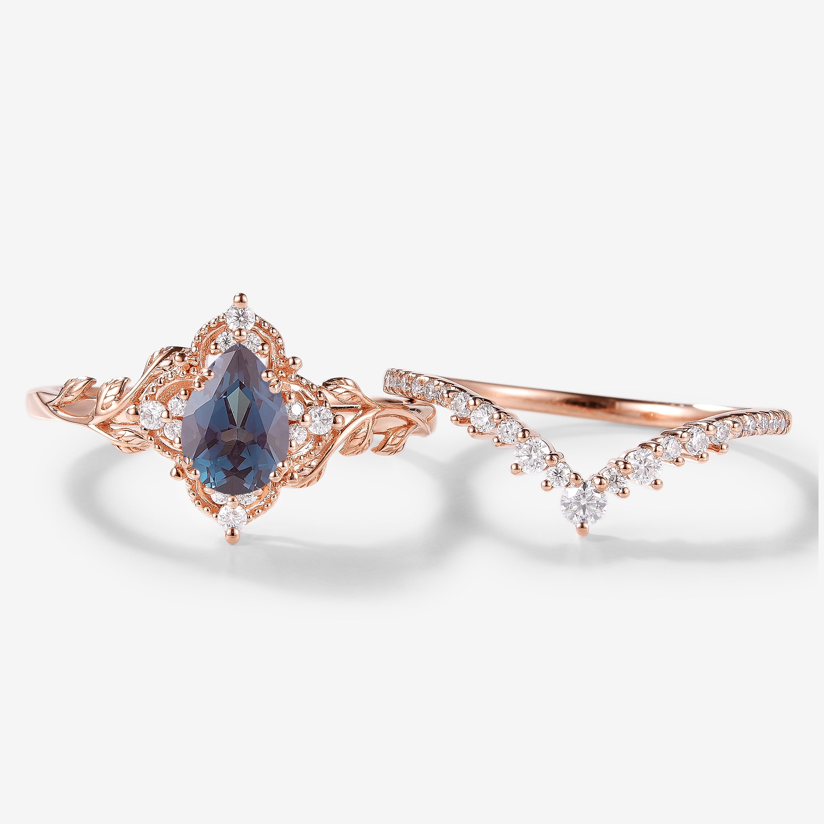 Rose gold pear-cut Alexandrite leaf bridal set with moissanite accents, vintage engagement ring set