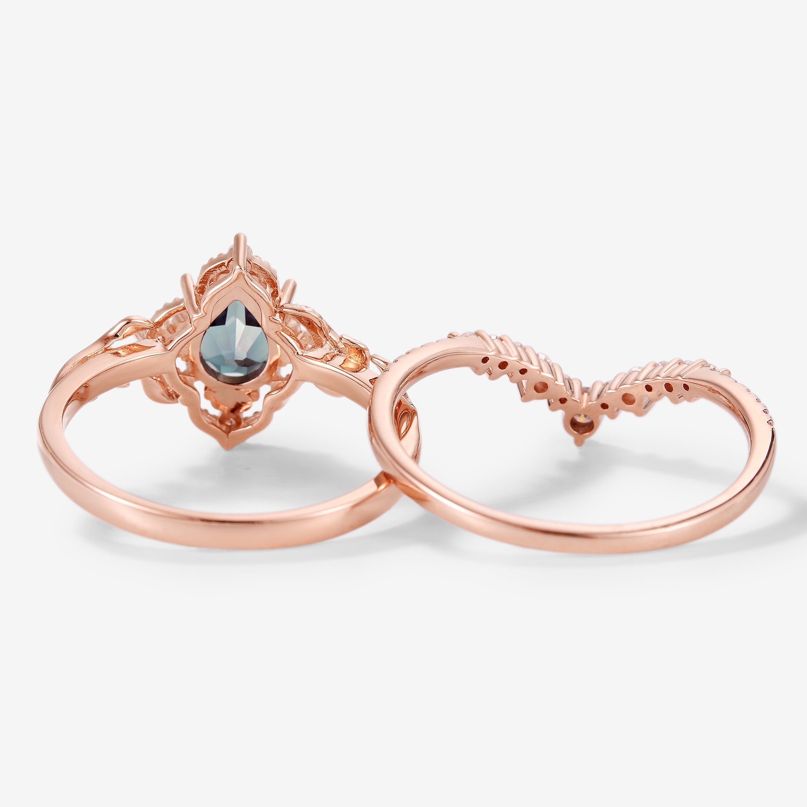 Rose gold pear-cut alexandrite bridal set with leaf details and moissanite accents, vintage engagement ring set