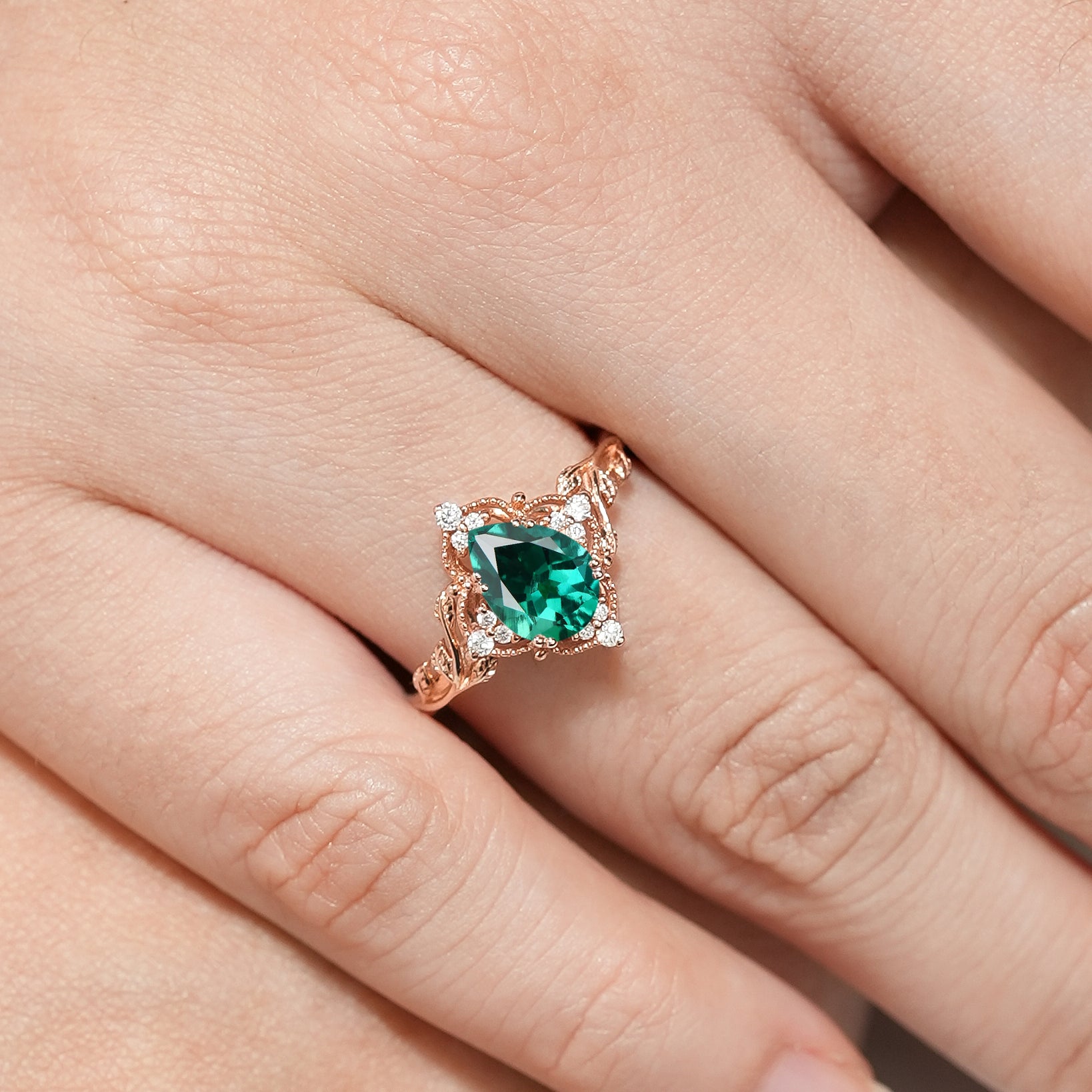 Square Emerald Engagement Ring with Leaf Detailing