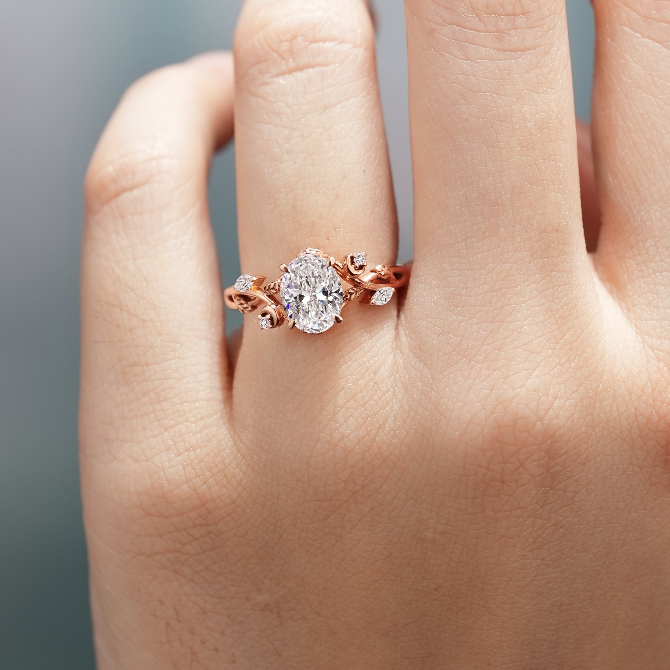 Rose gold leaf engagement ring with oval lab grown diamond