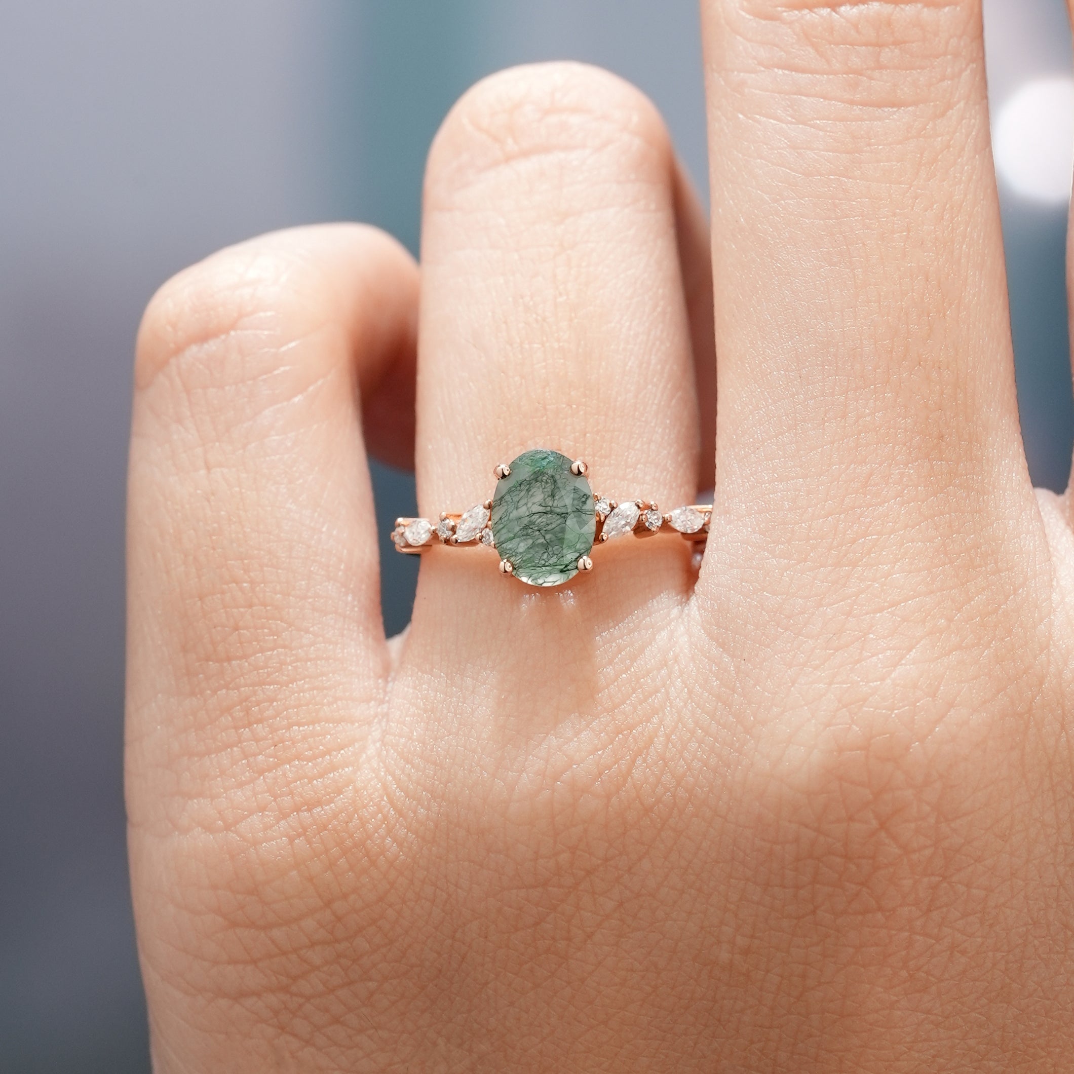 Oval moss agate engagement ring with moissanite accents