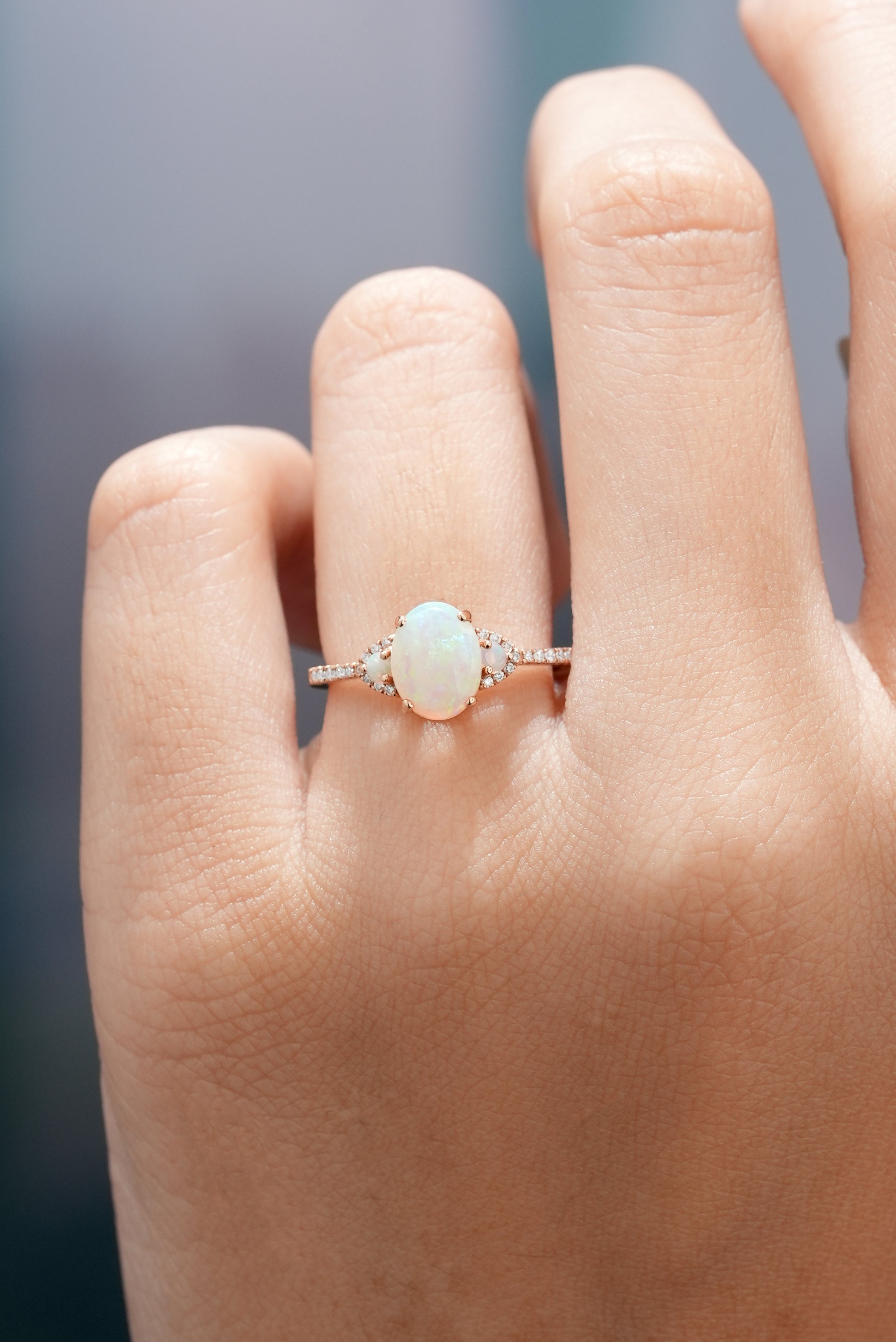 Oval Opal Engagement Ring on Hand in Rose Gold