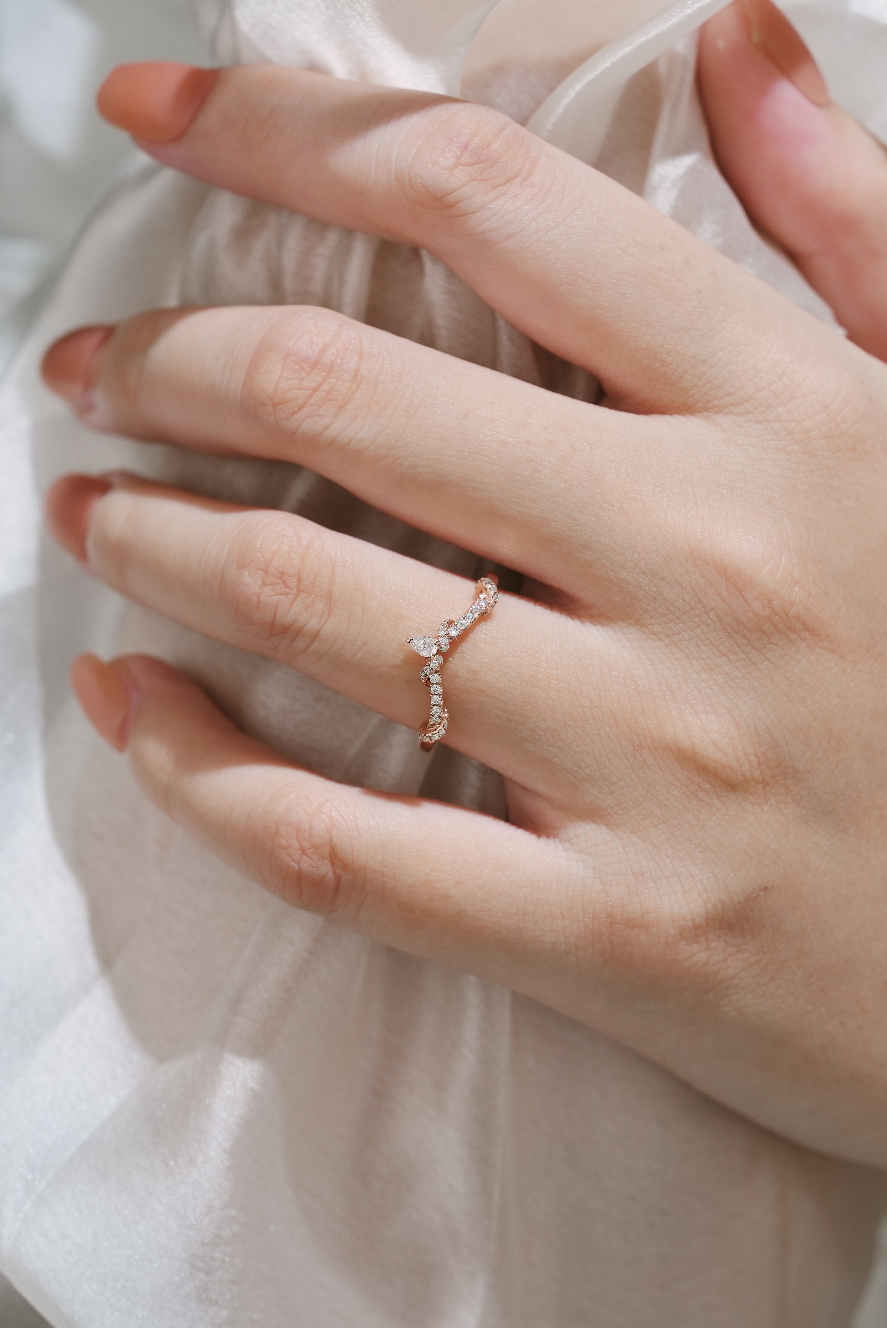 Rose gold moissanite twisted wedding band on a hand, wedding ring, bridal set