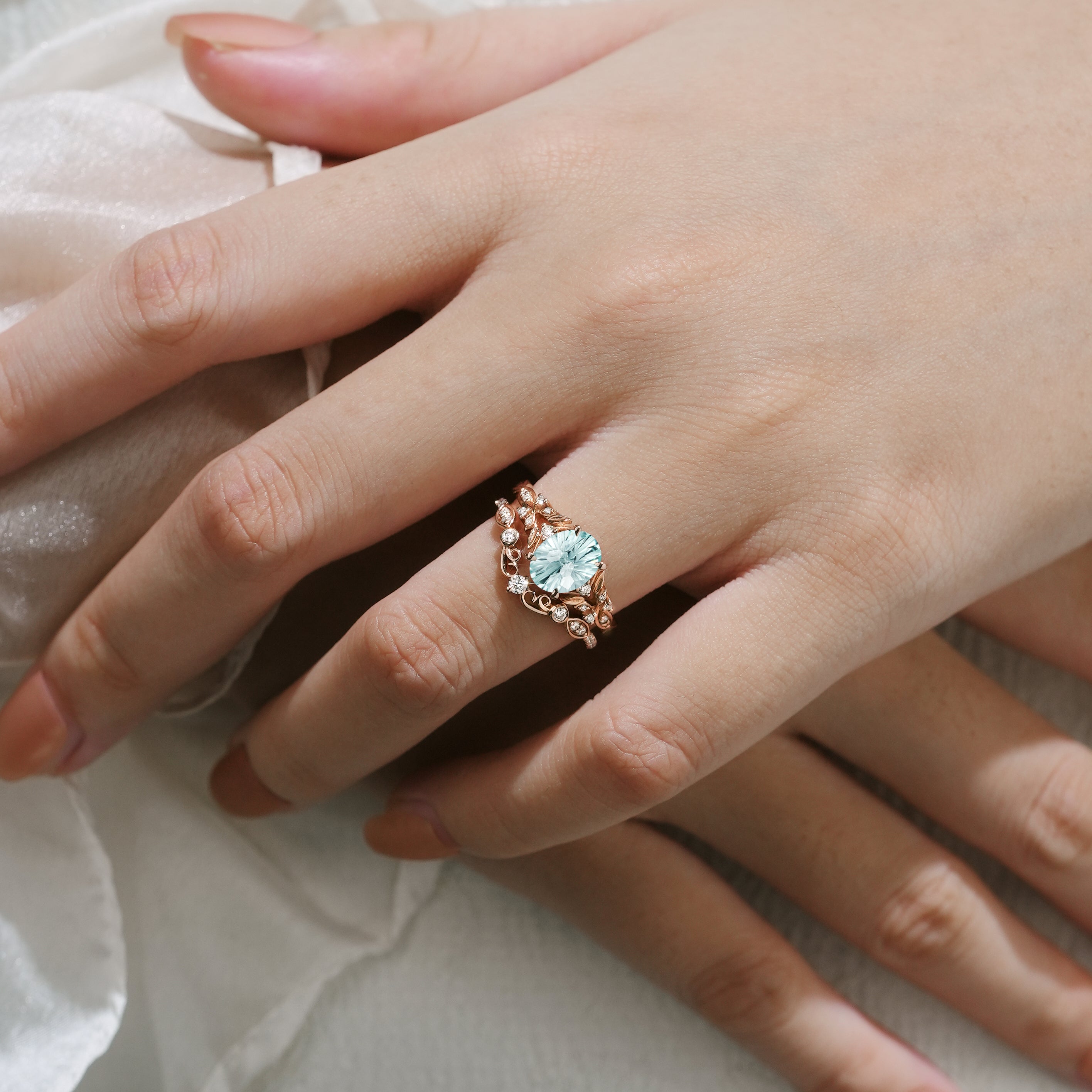 Aquamarine leaf engagement ring set on hand, rose gold