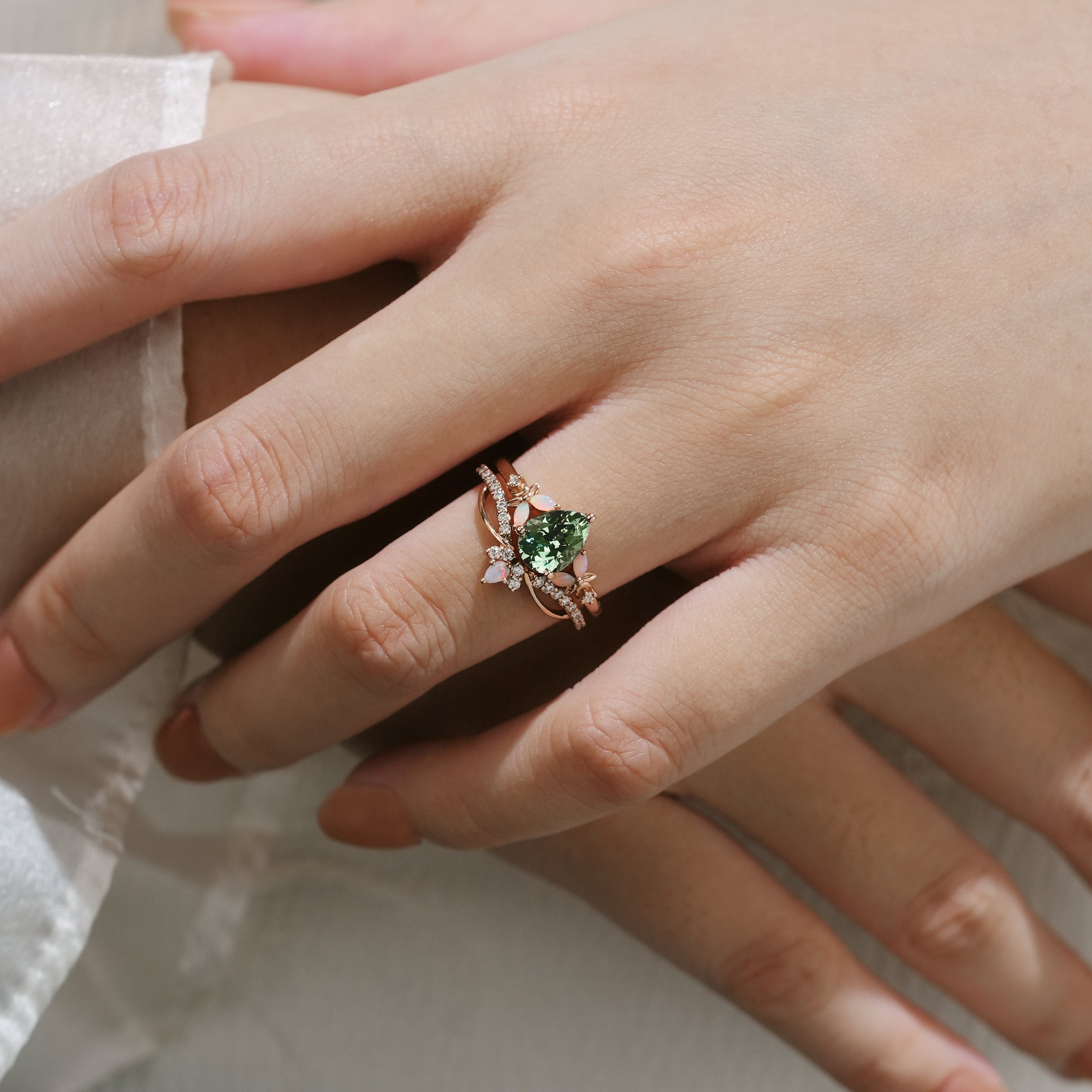 Rose gold floral engagement ring set with green sapphire