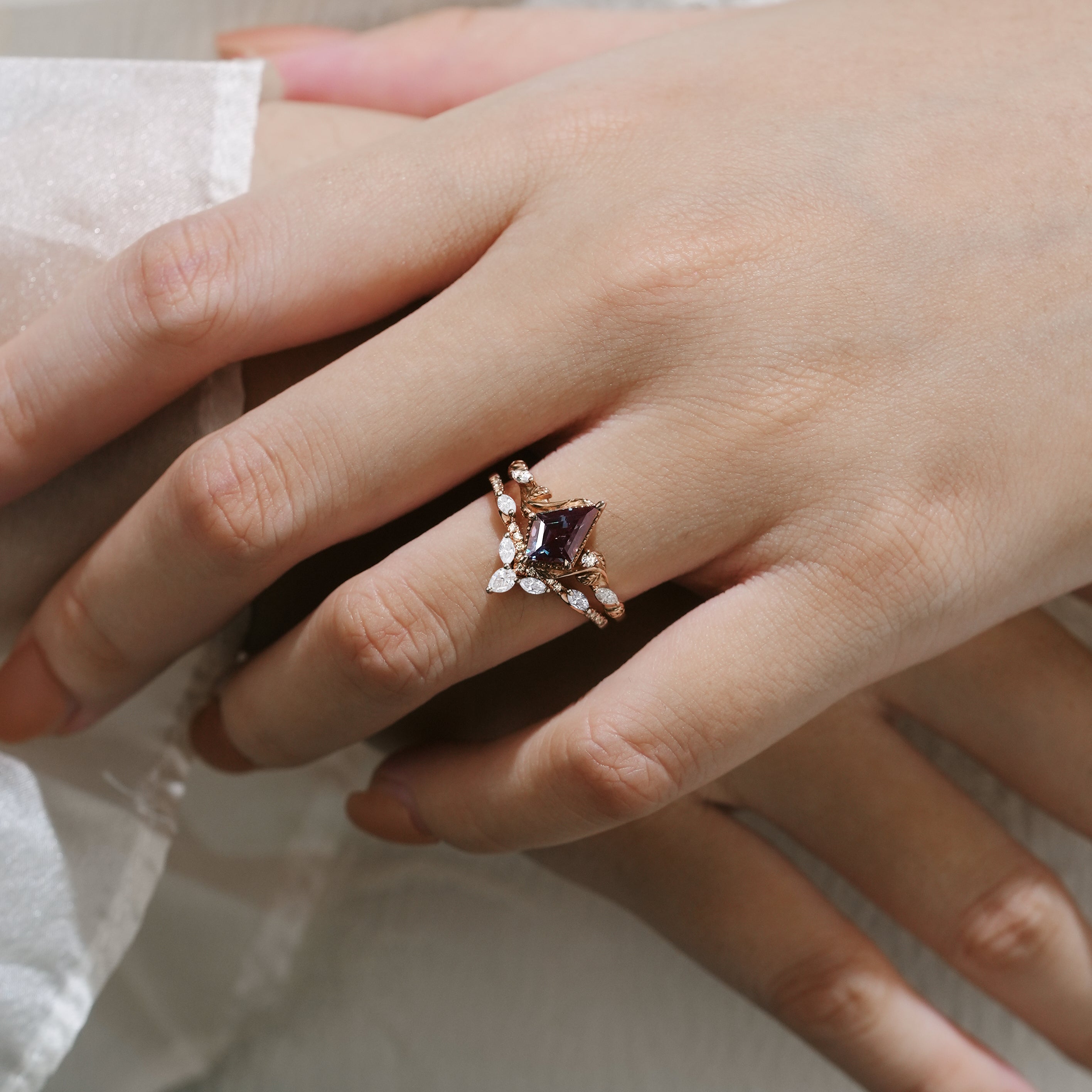 Woman wearing a kite cut alexandrite engagement ring, leaf bridal set, Lahela Jewelry