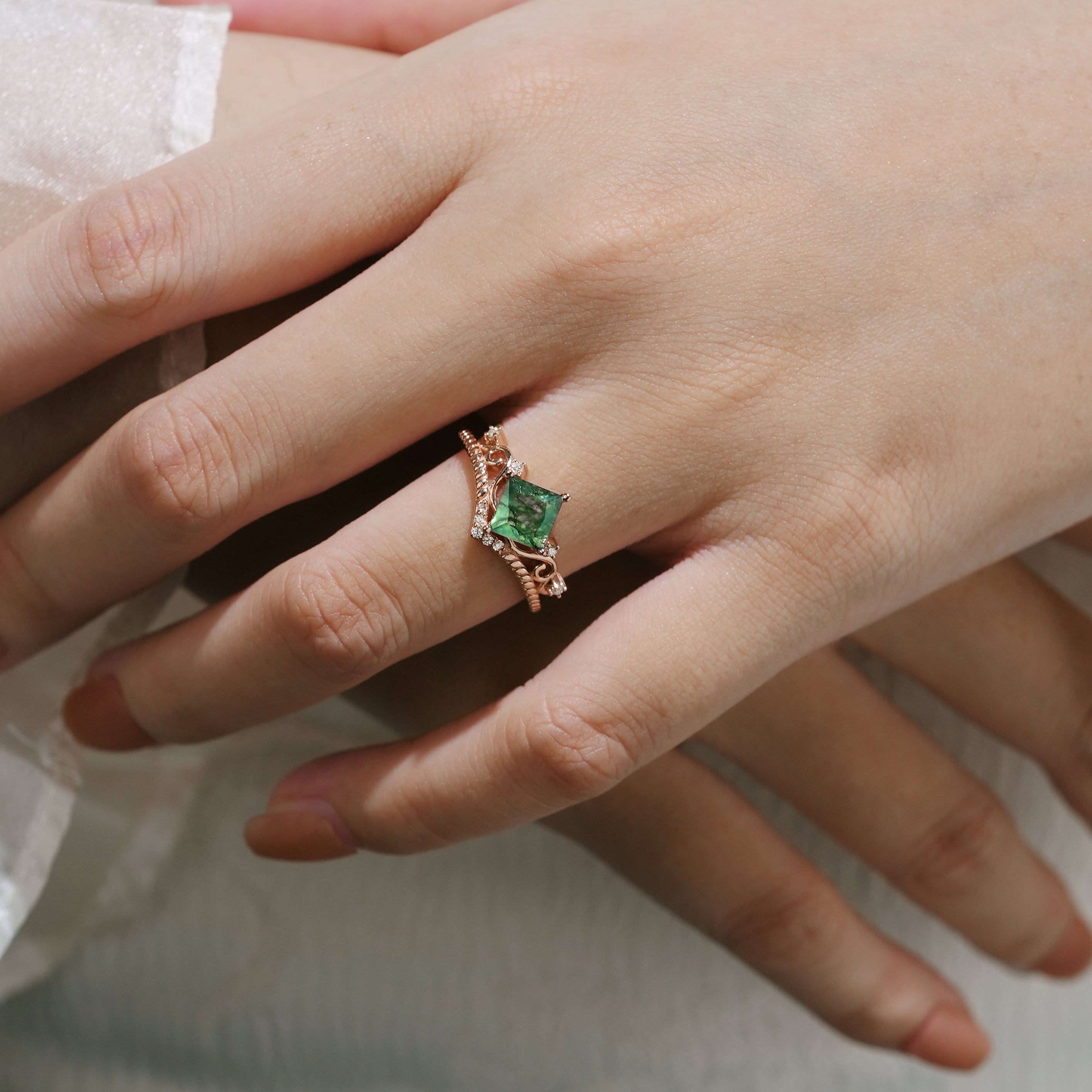 Elegant princess cut moss agate ring on hand