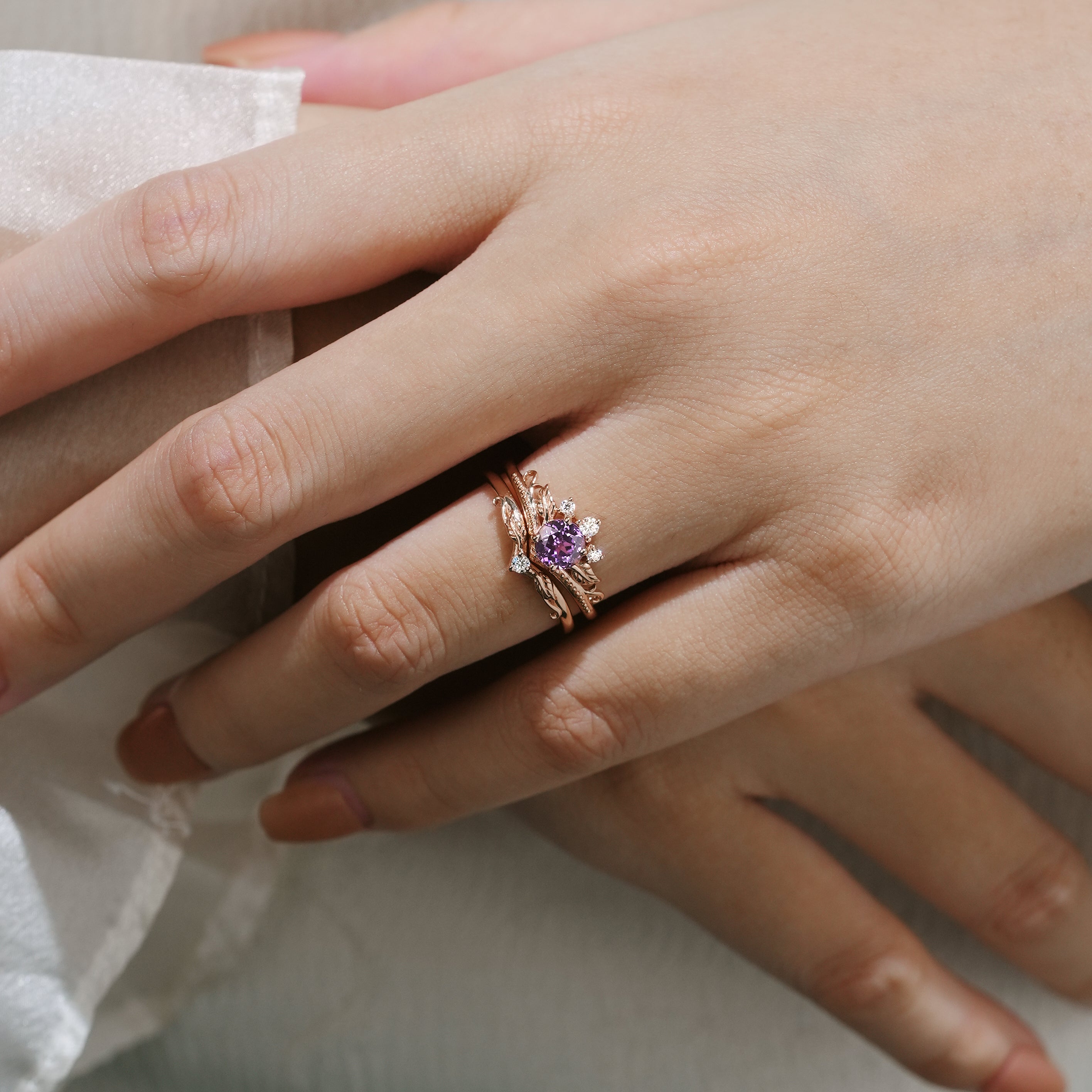 Purple sapphire leaf engagement ring set worn on hand