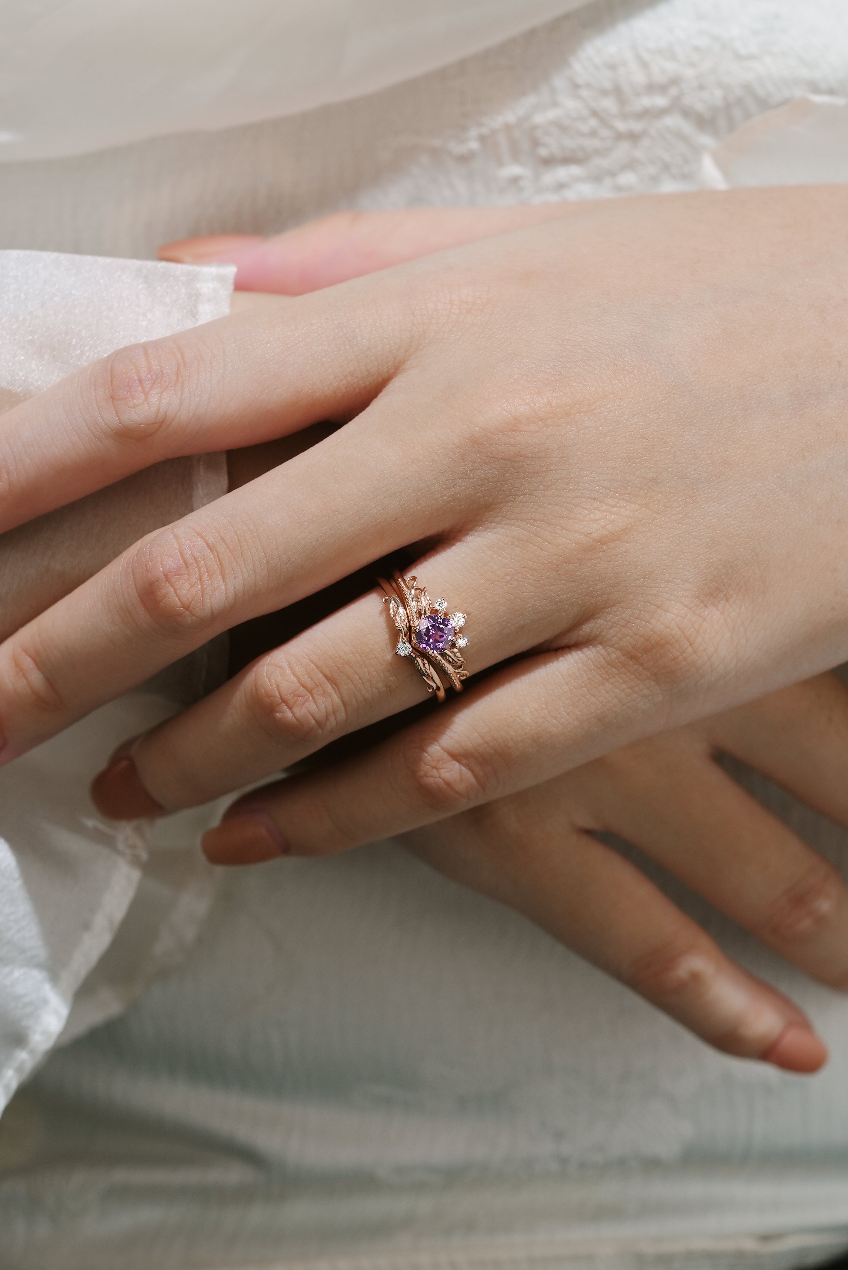 Purple sapphire leaf engagement ring set worn on hand