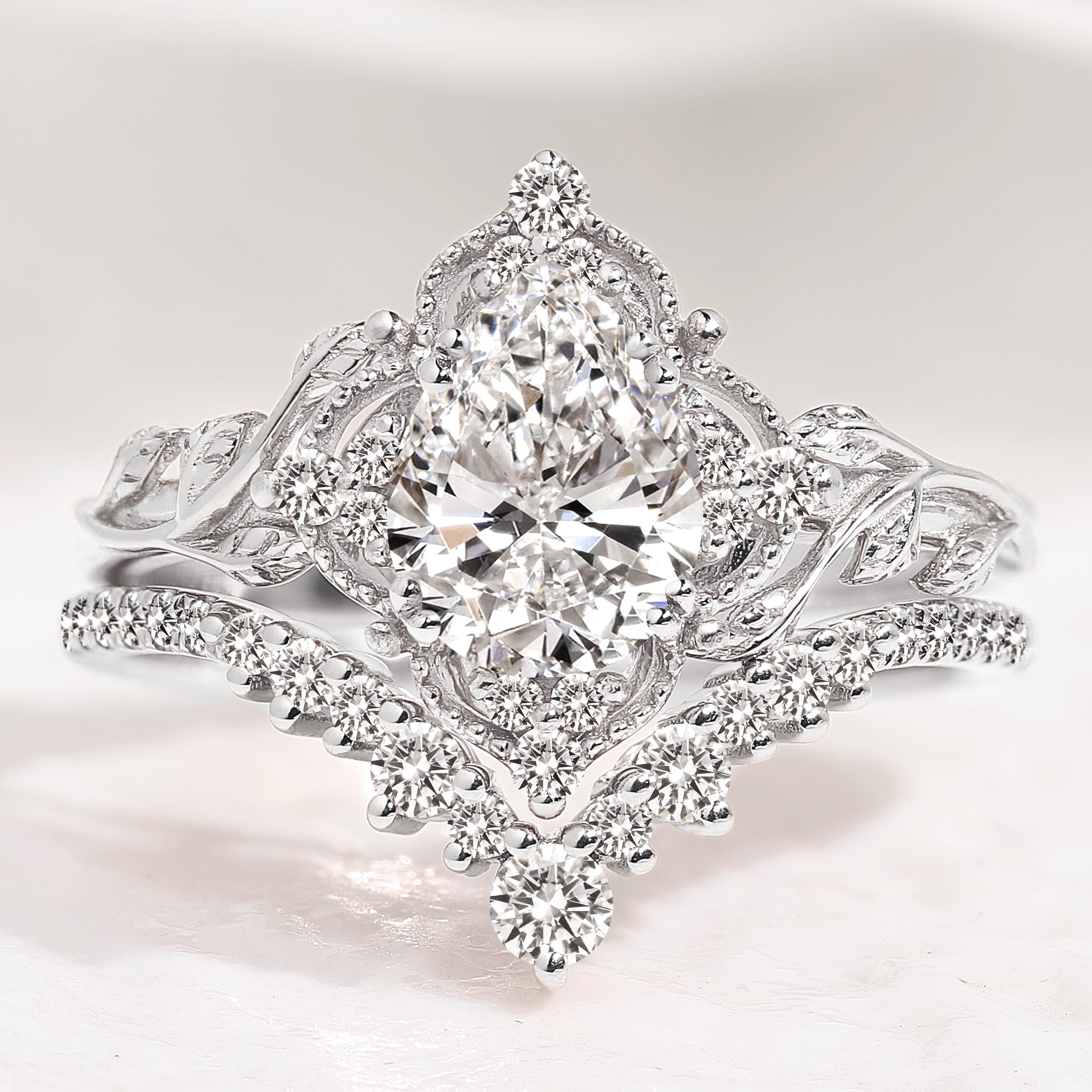 Nature-inspired pear cut diamond engagement ring set