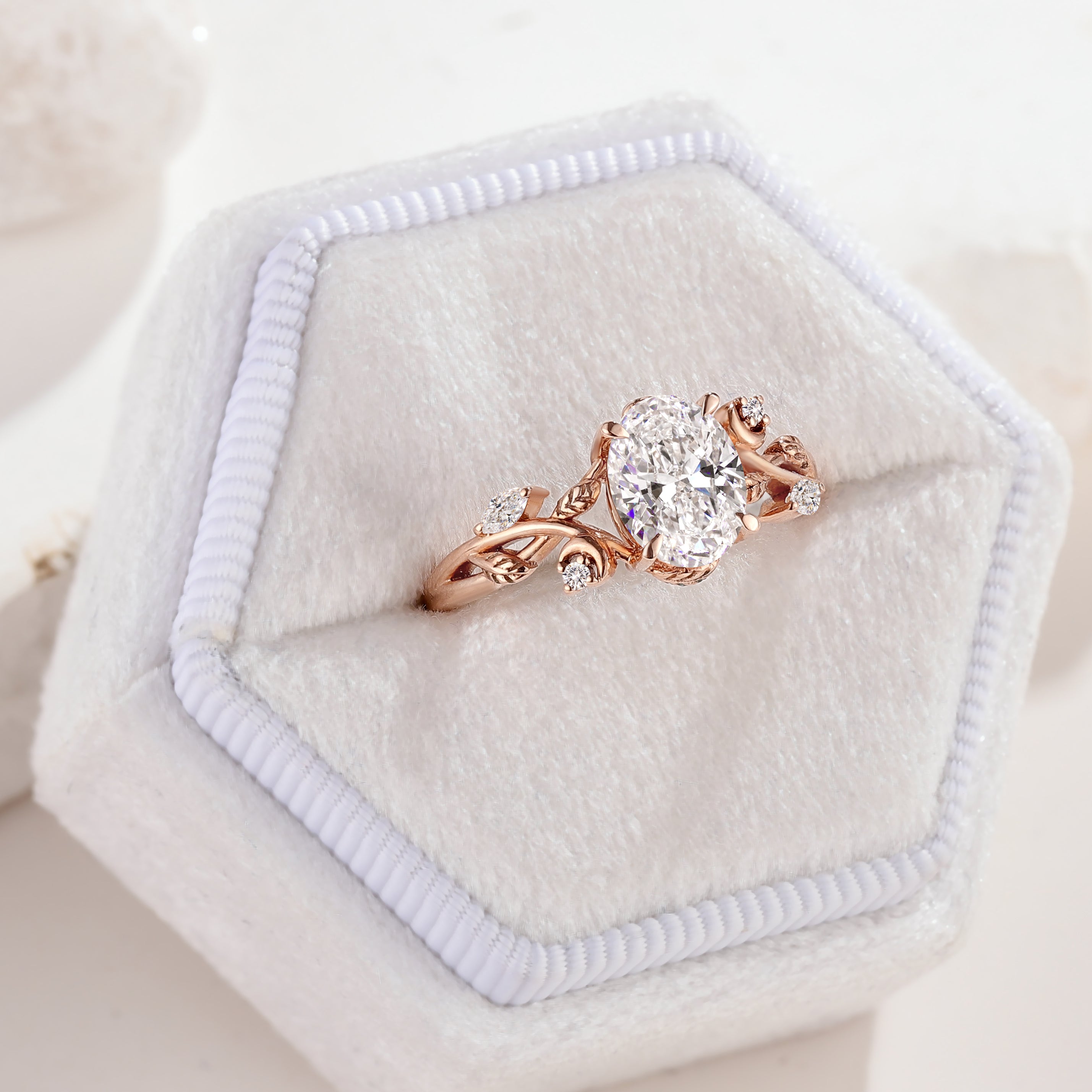 Nature-inspired oval diamond ring with leaf design