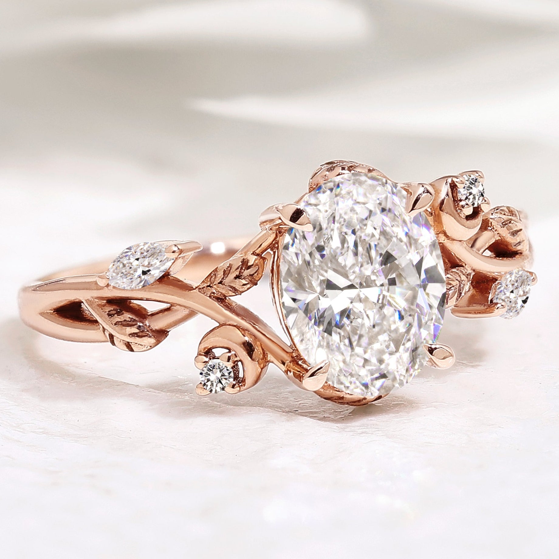 Nature-Inspired Oval Diamond Engagement Ring with Leaf Design