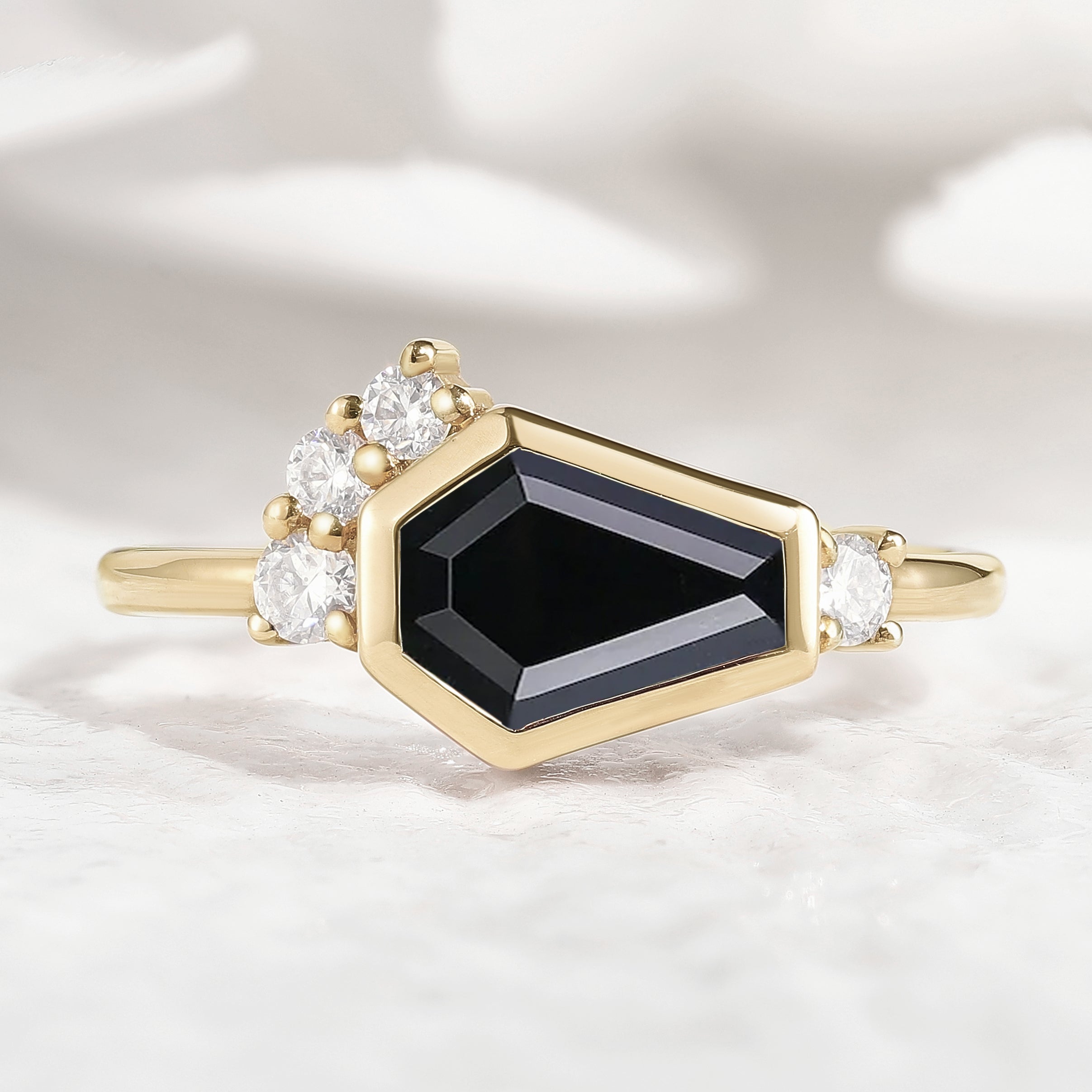 Gold ring with coffin-cut black onyx and diamond accents