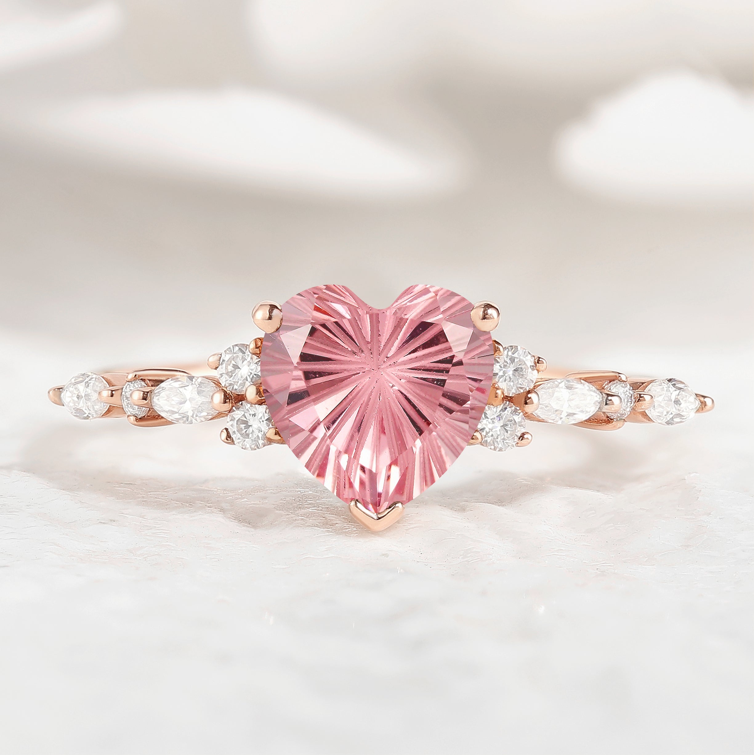 Heart-cut Padparadscha engagement ring with moissanite accents