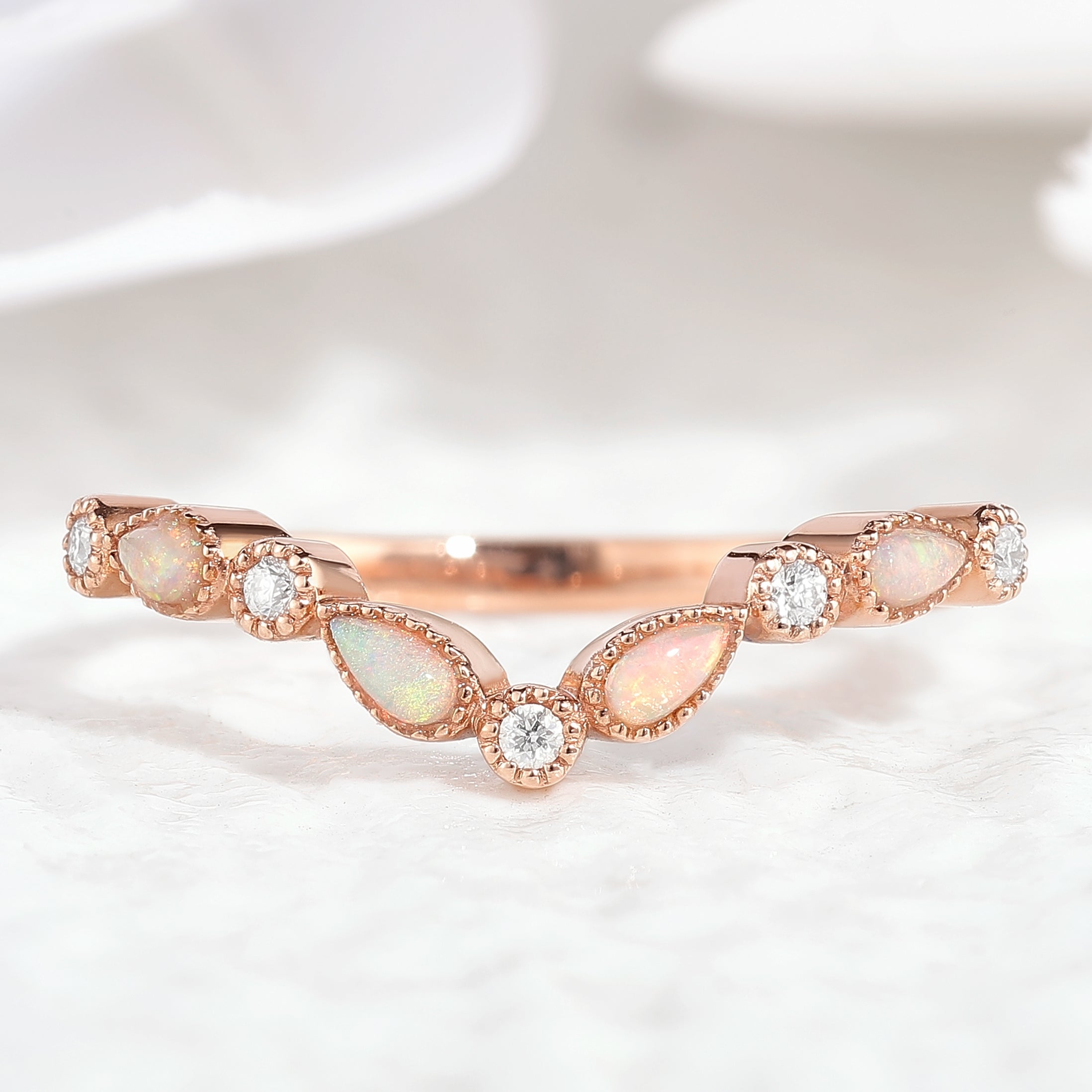 Rose gold stackable chevron wedding band with opal and moissanite stones