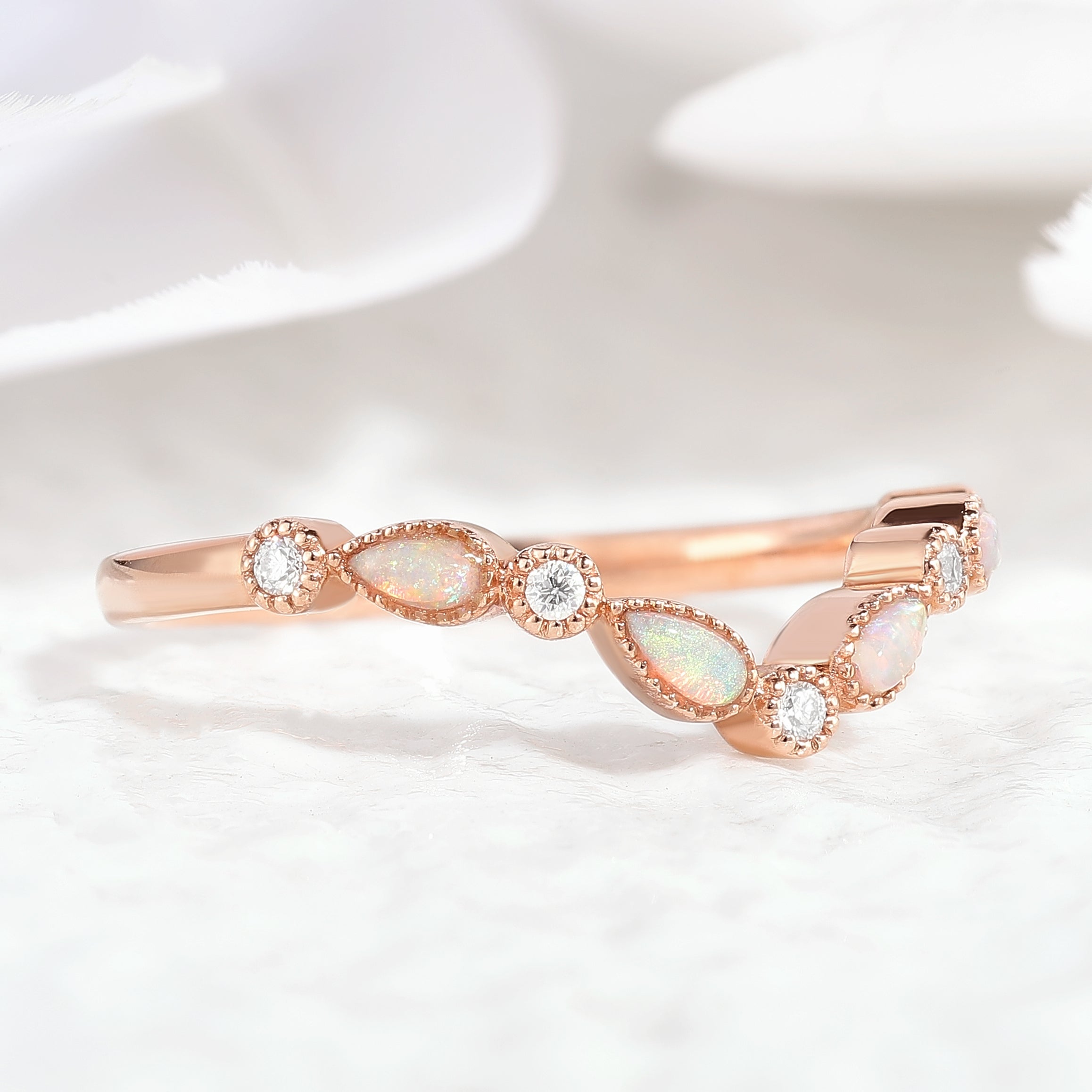 Rose gold chevron wedding band with opal and moissanite