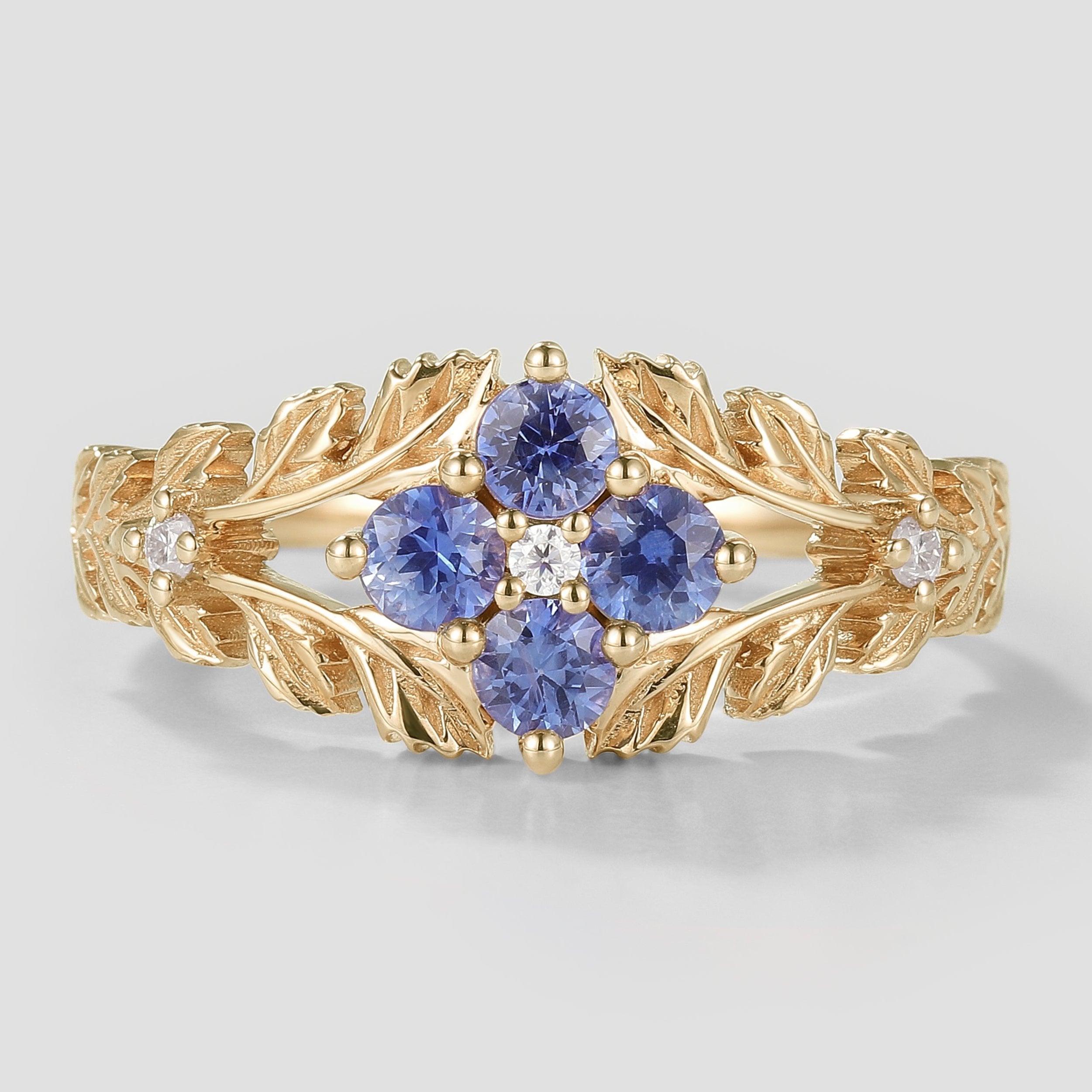 Nature-inspired lab-grown Cornflower sapphire engagement ring with leaf design