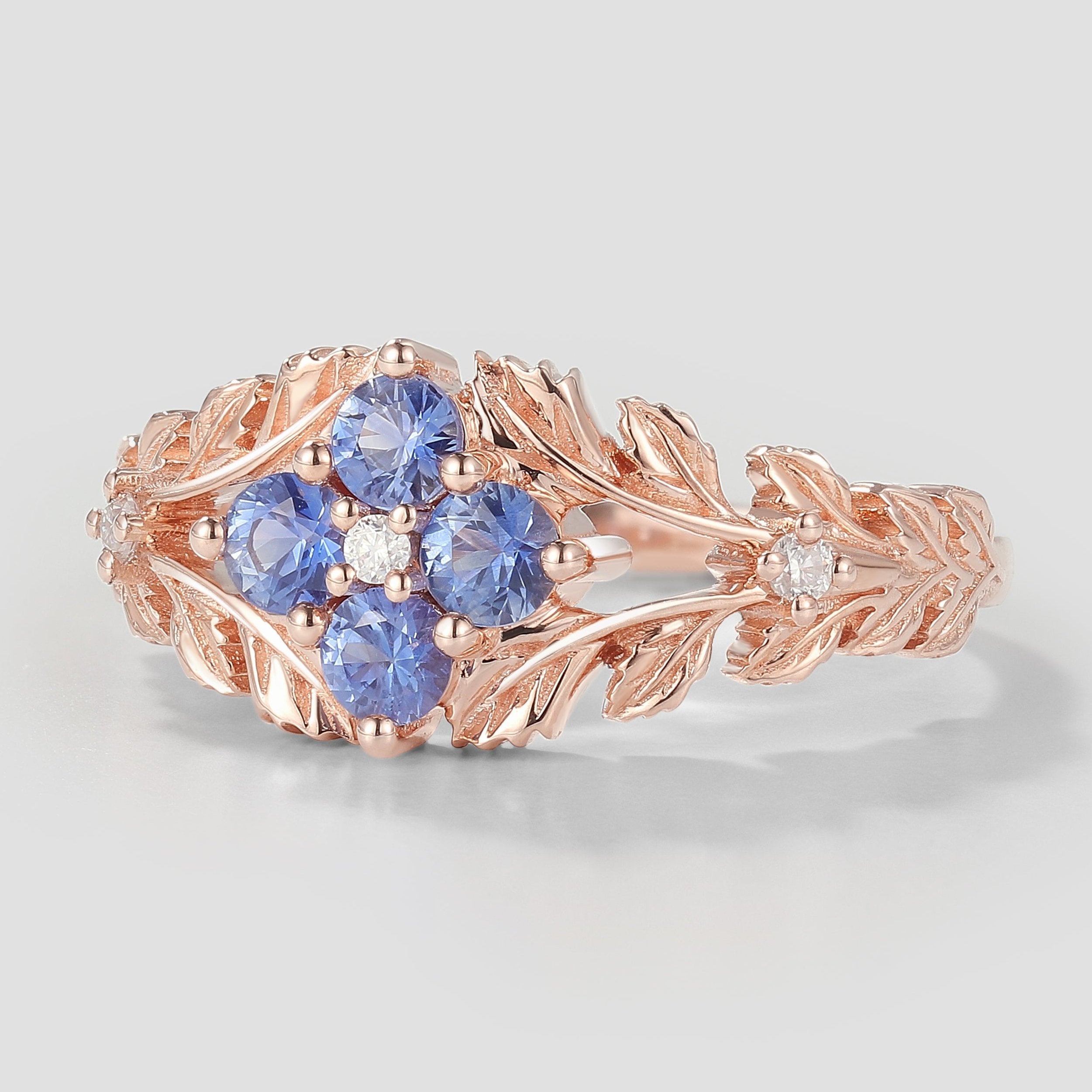 Rose gold Cornflower sapphire ring with leaf details